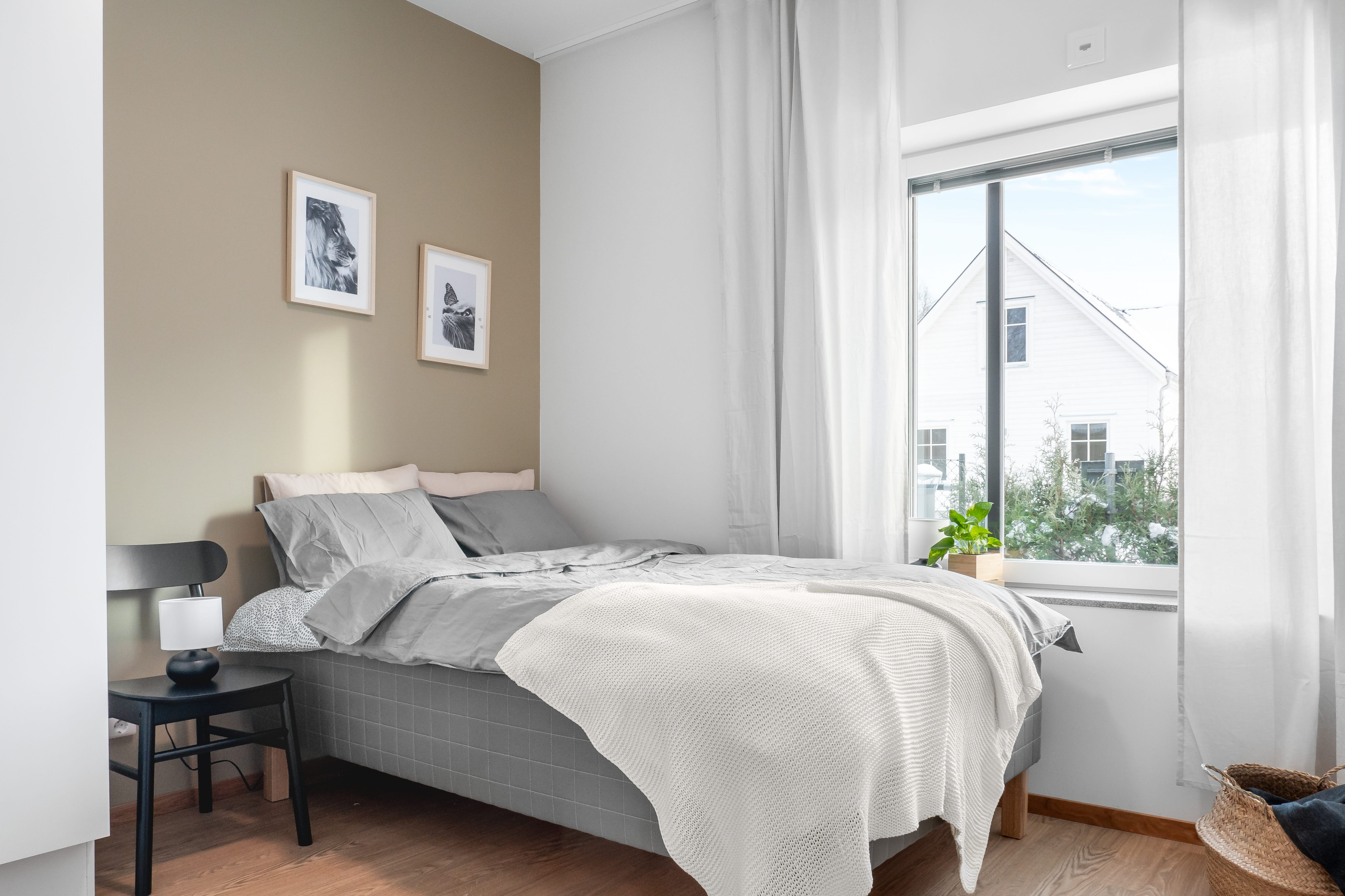 A bedroom with a large bed in a hotel room