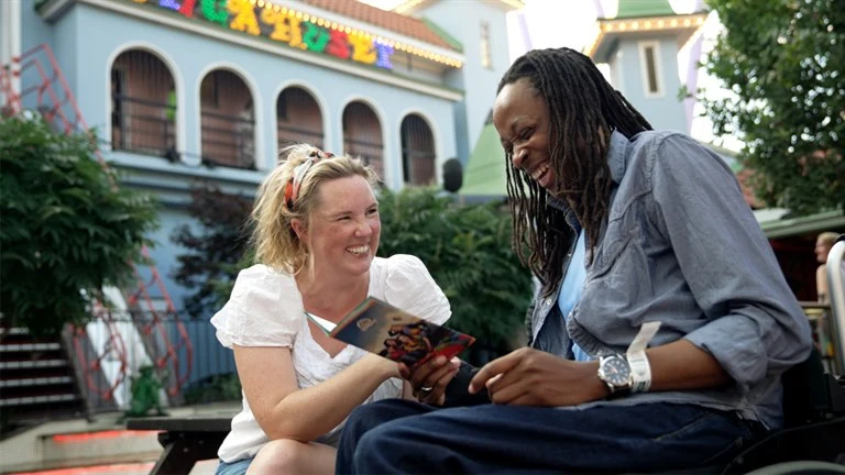 Two persons laughing together