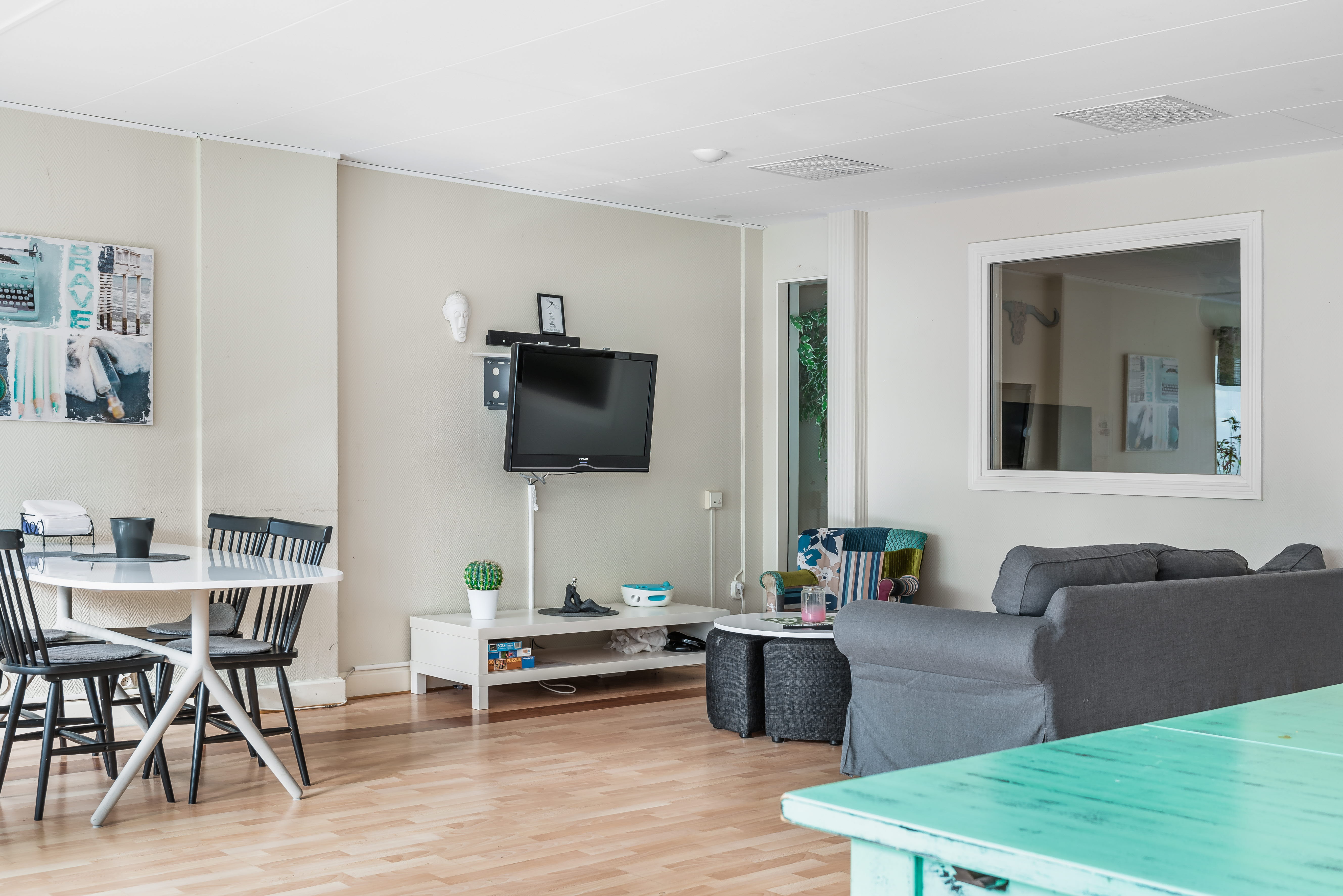 A living room filled with furniture and a flat screen tv