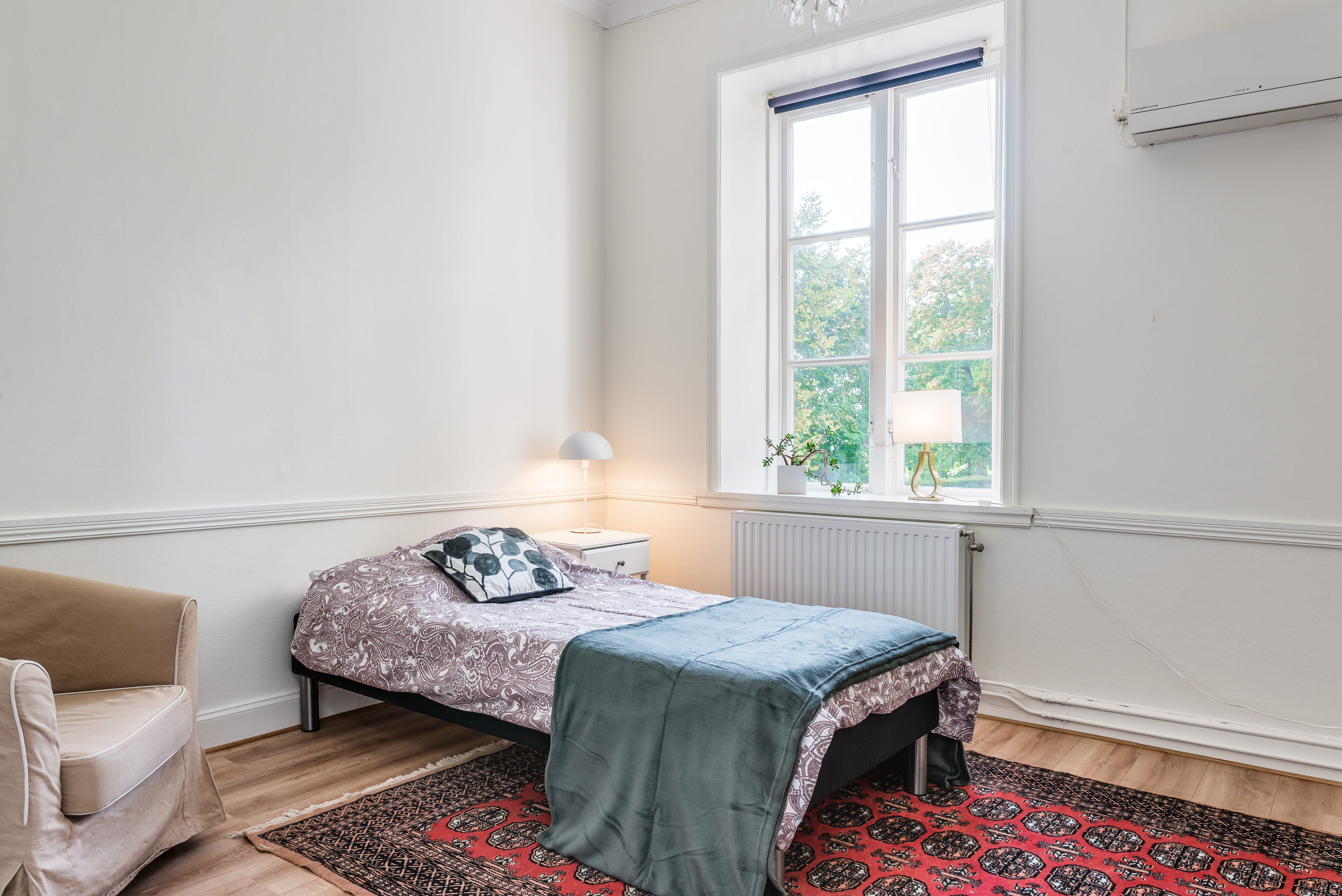 A bedroom with a large window