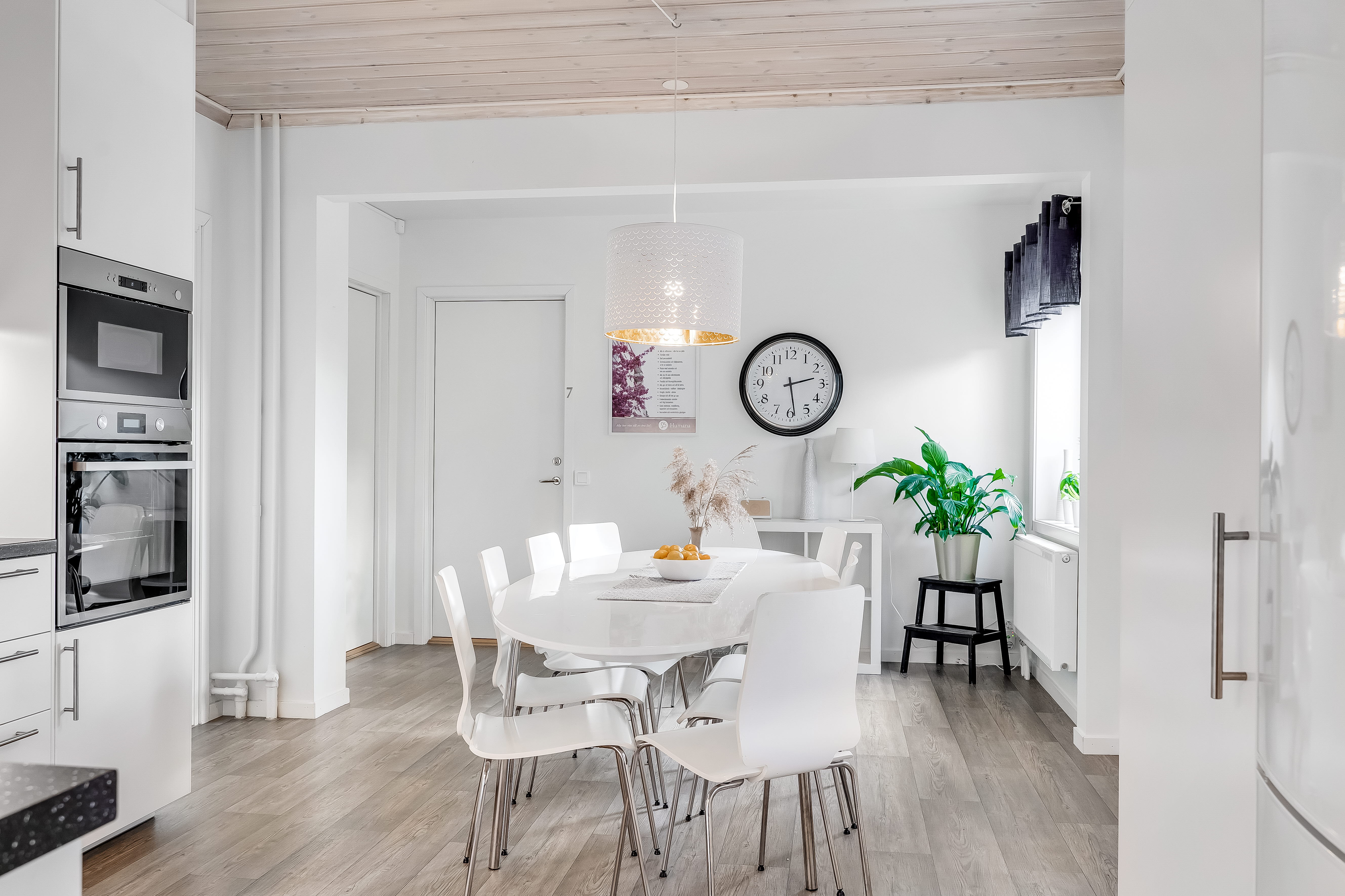 A kitchen with a dining room table