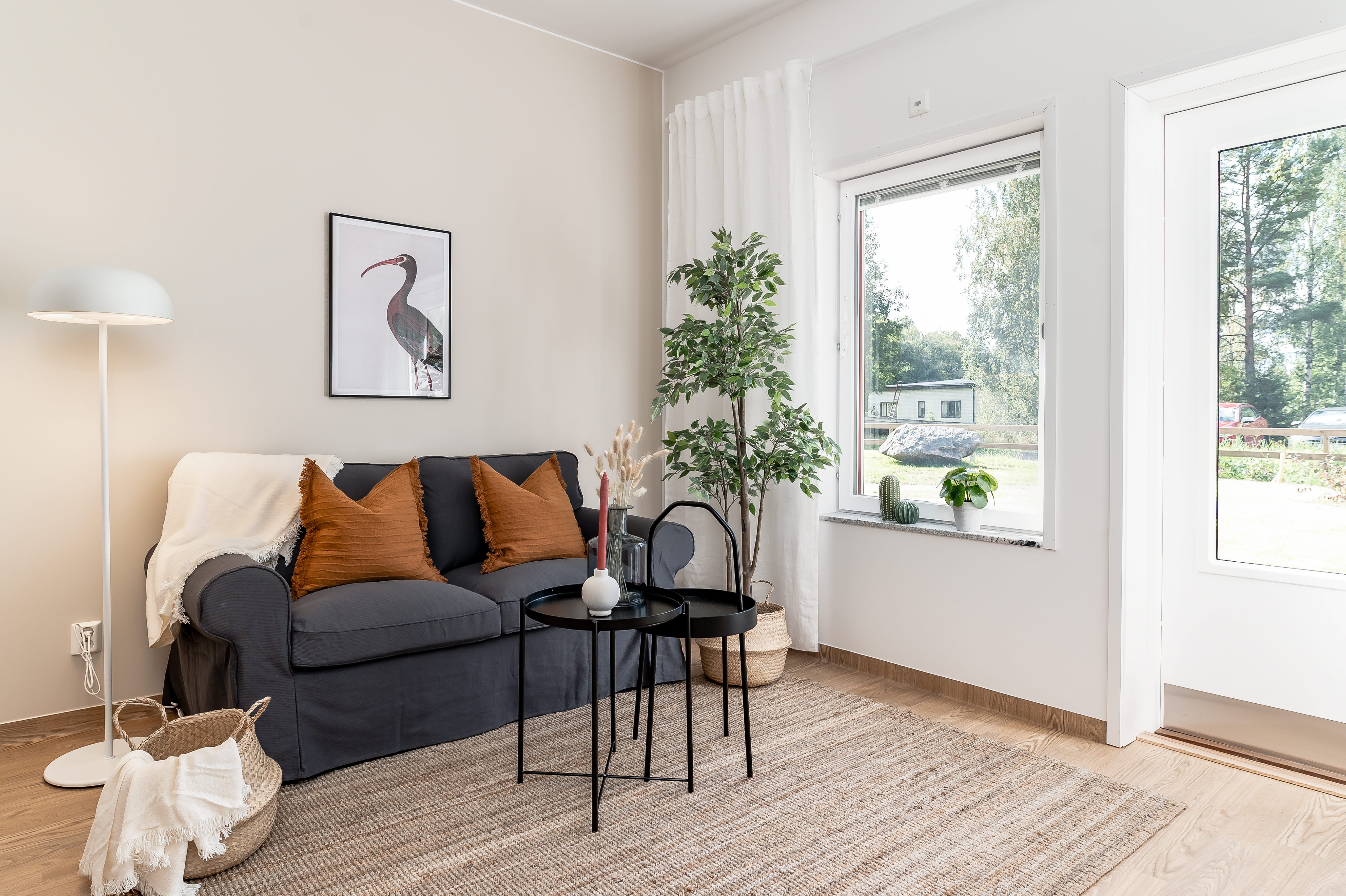 A living room filled with furniture and a large window