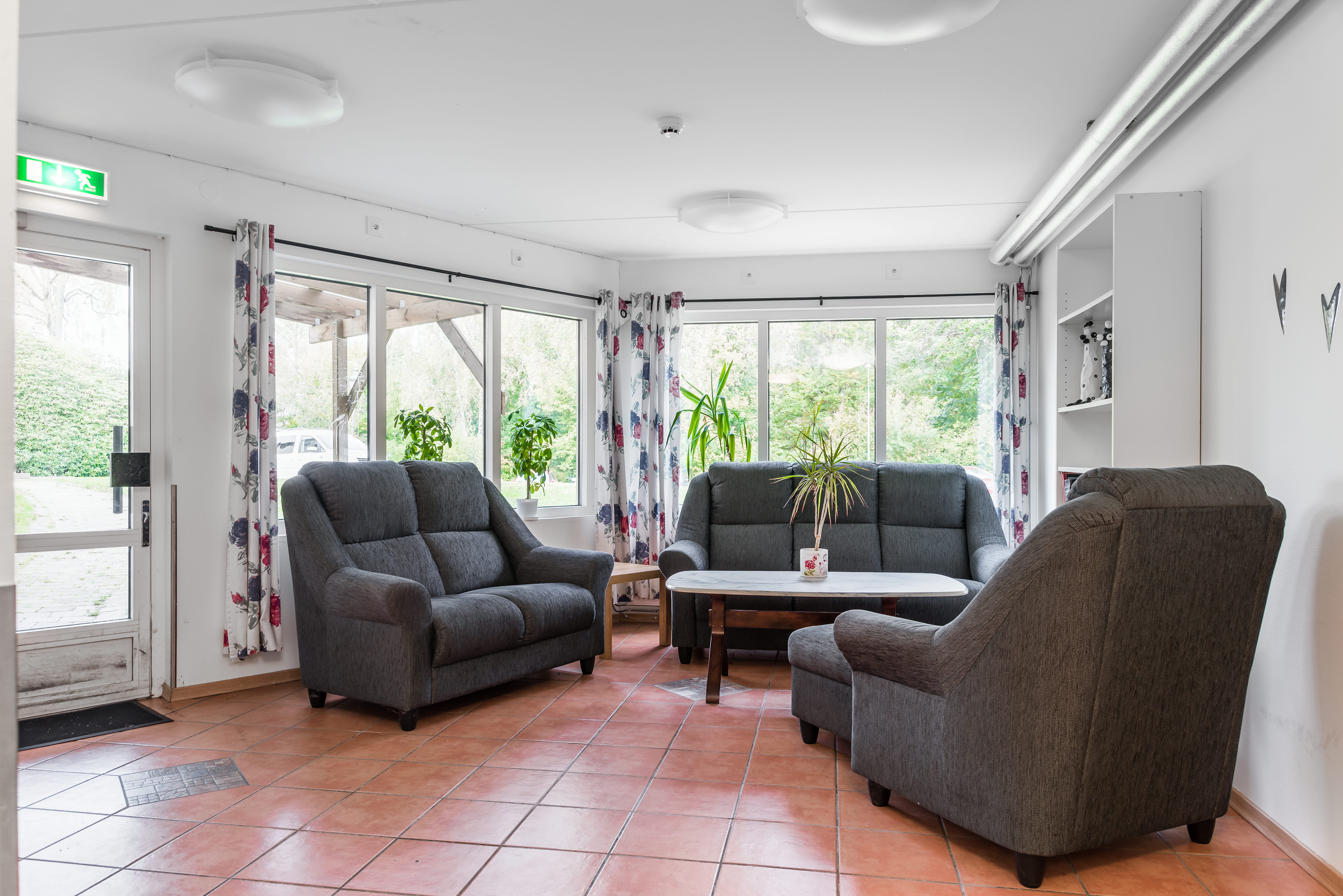 A living room filled with furniture and a large window