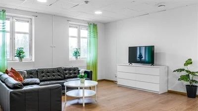 A living room filled with furniture and a flat screen tv