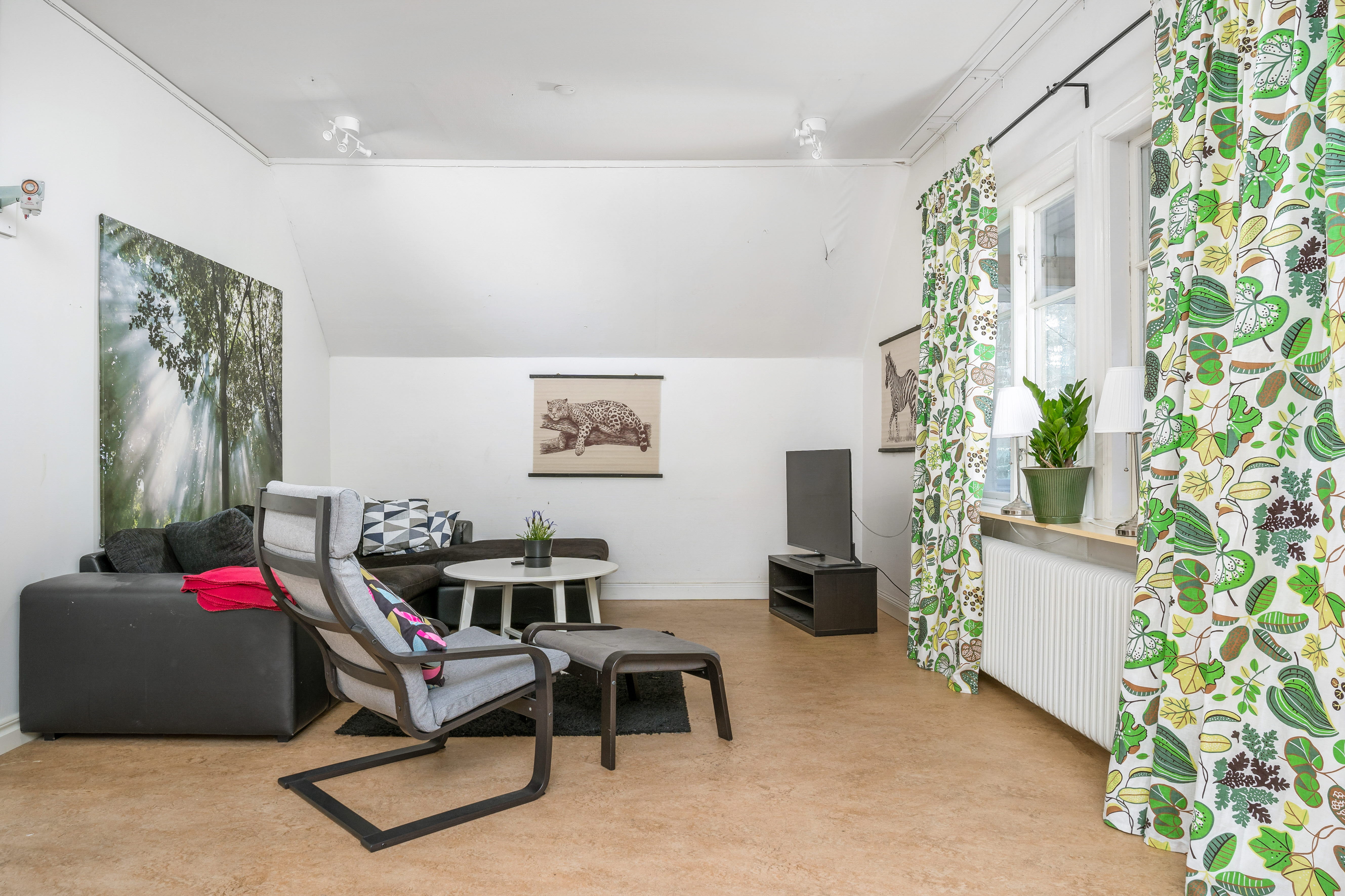 A living room filled with furniture and a large window