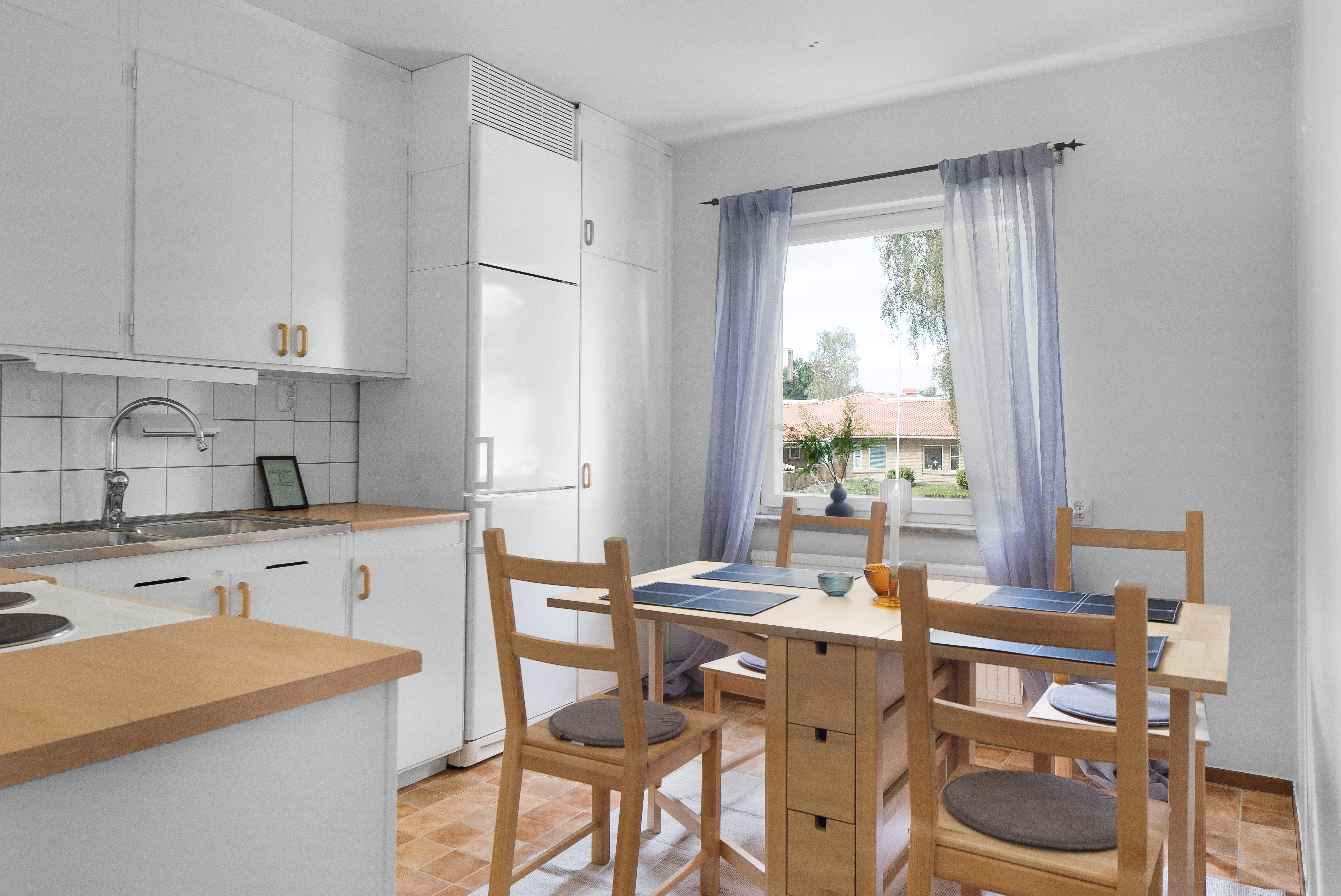 A kitchen with a dining room table