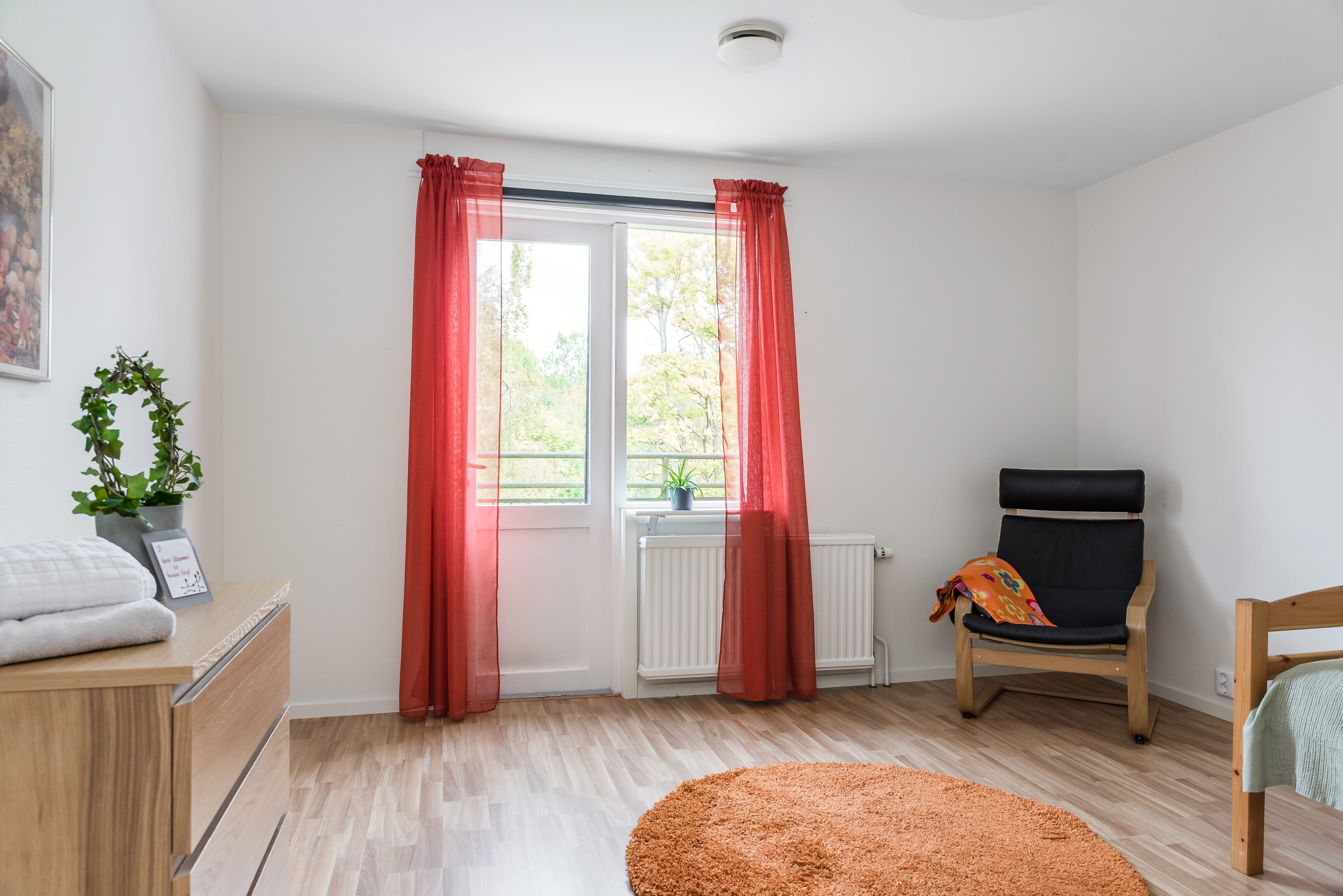 A living room filled with furniture and a large window