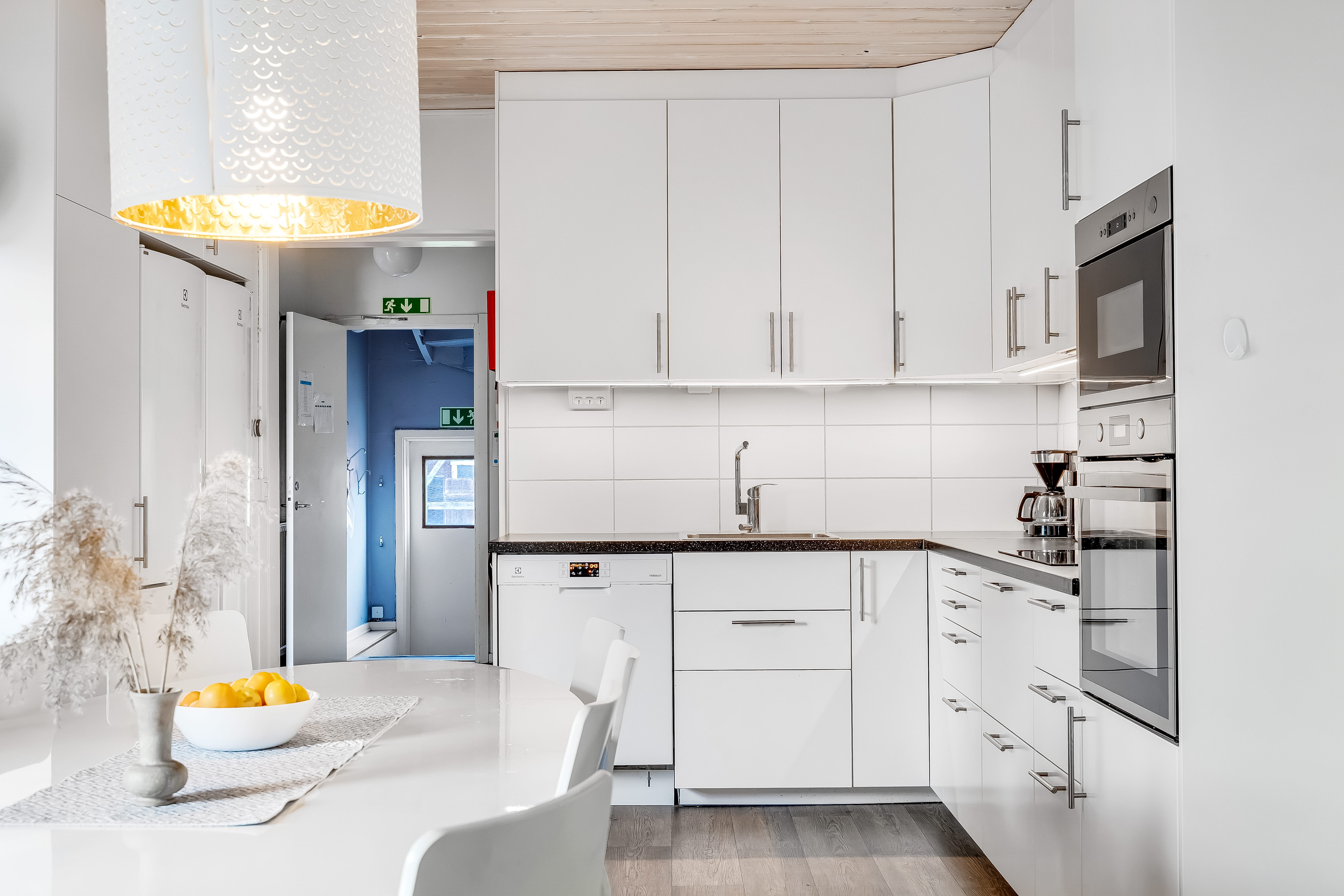 A kitchen with a stove and a sink