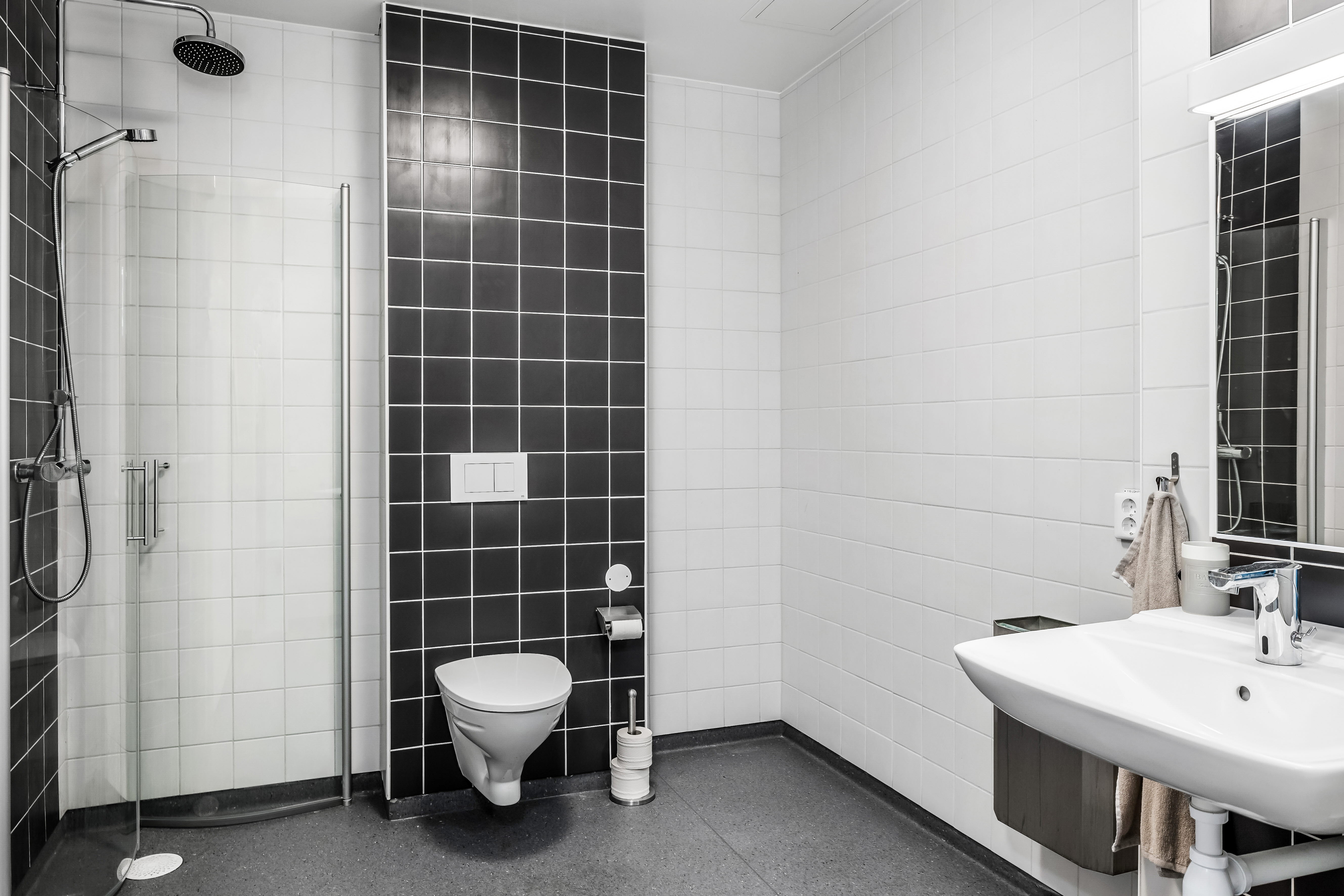 A room with a sink and a mirror
