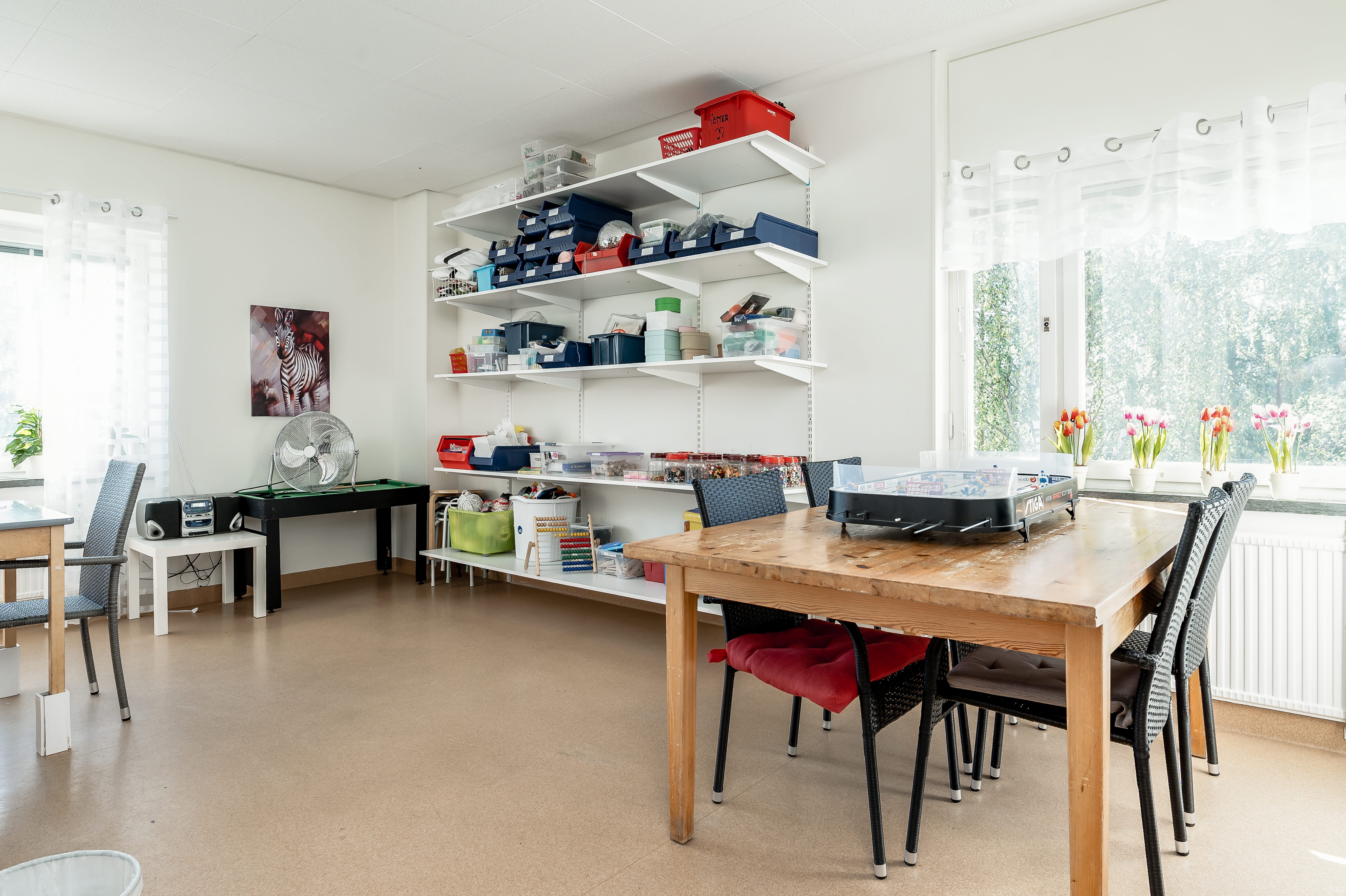 A kitchen with a dining room table