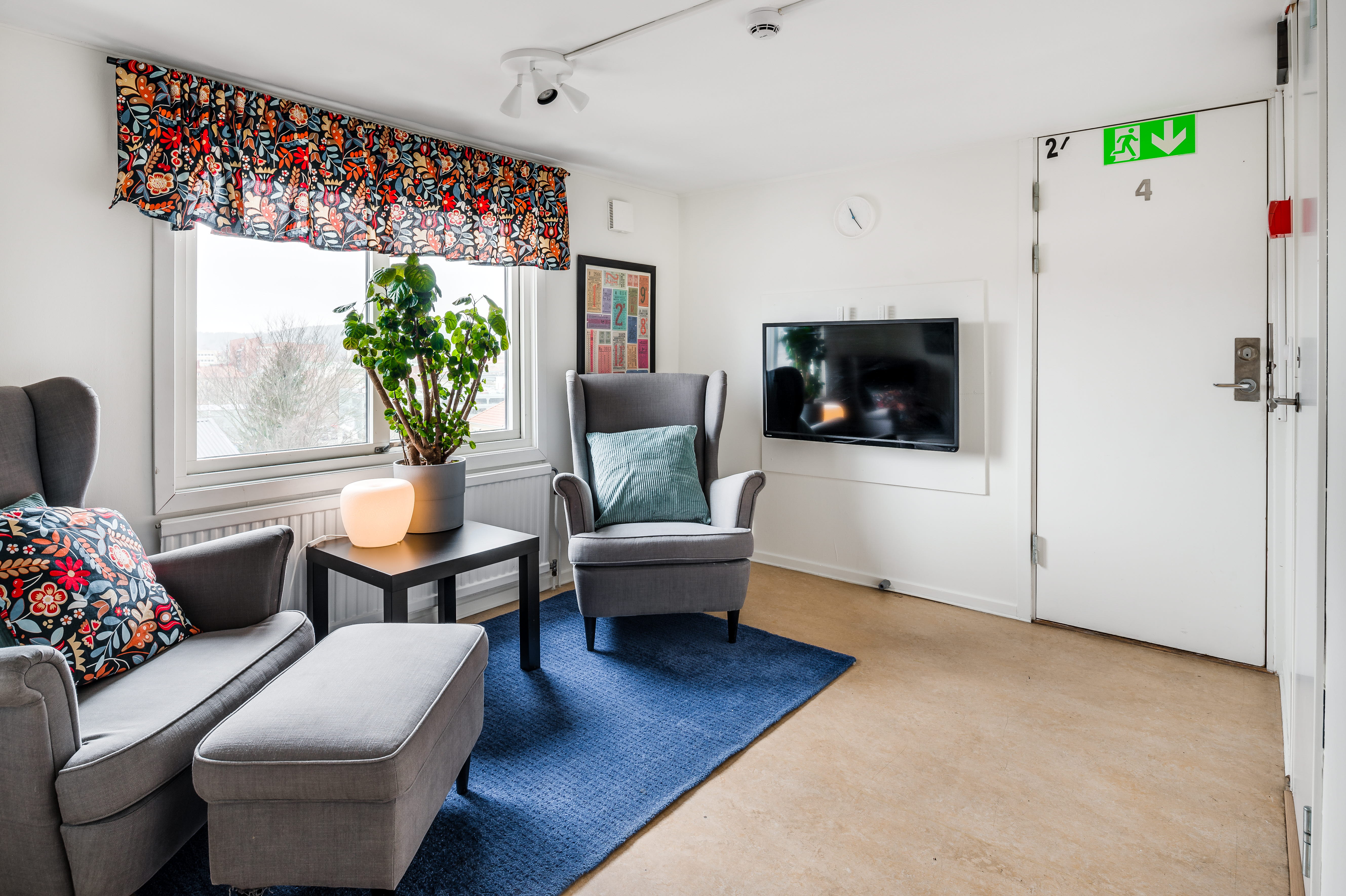 A living room filled with furniture and a large window