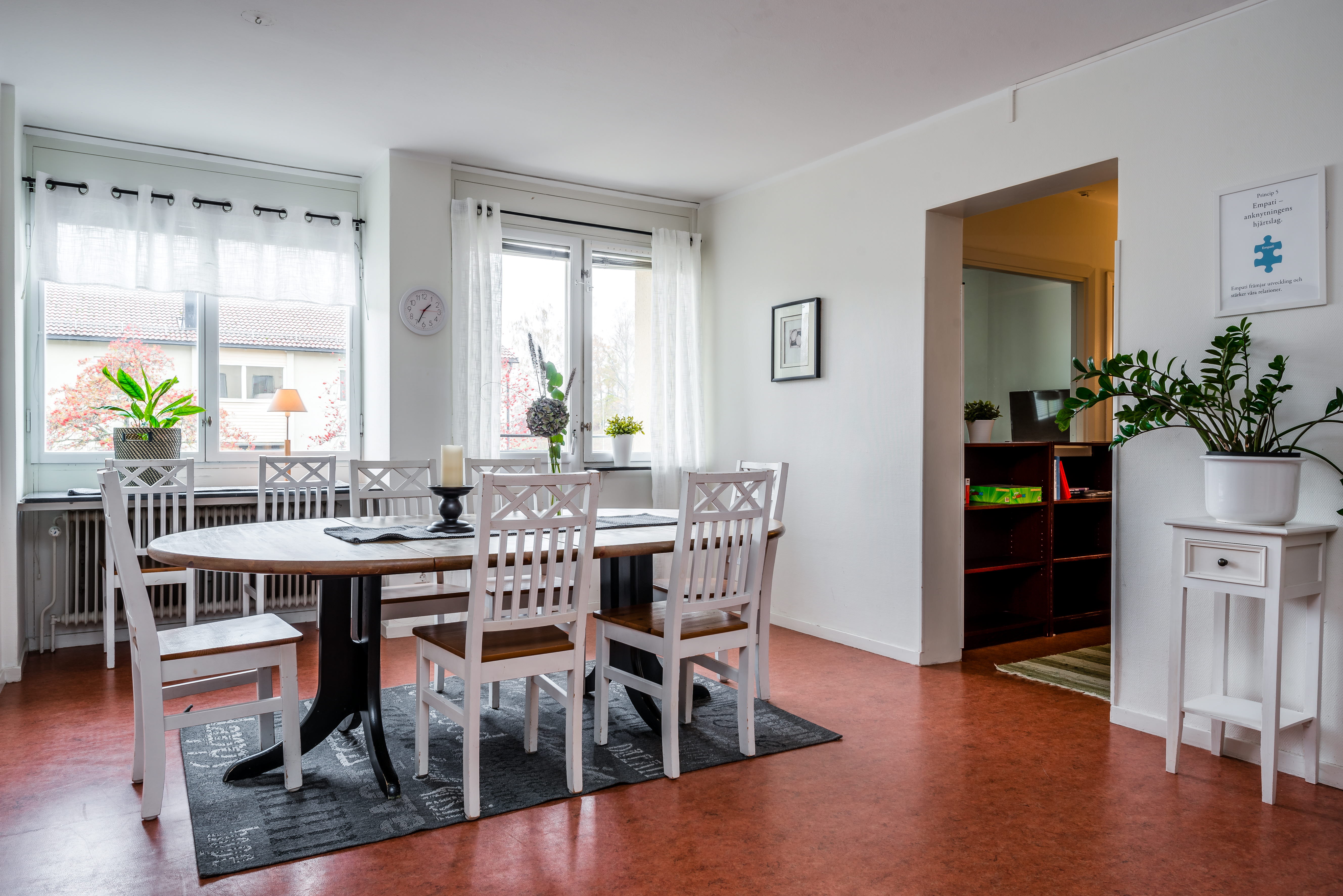 A living room filled with furniture and a large window