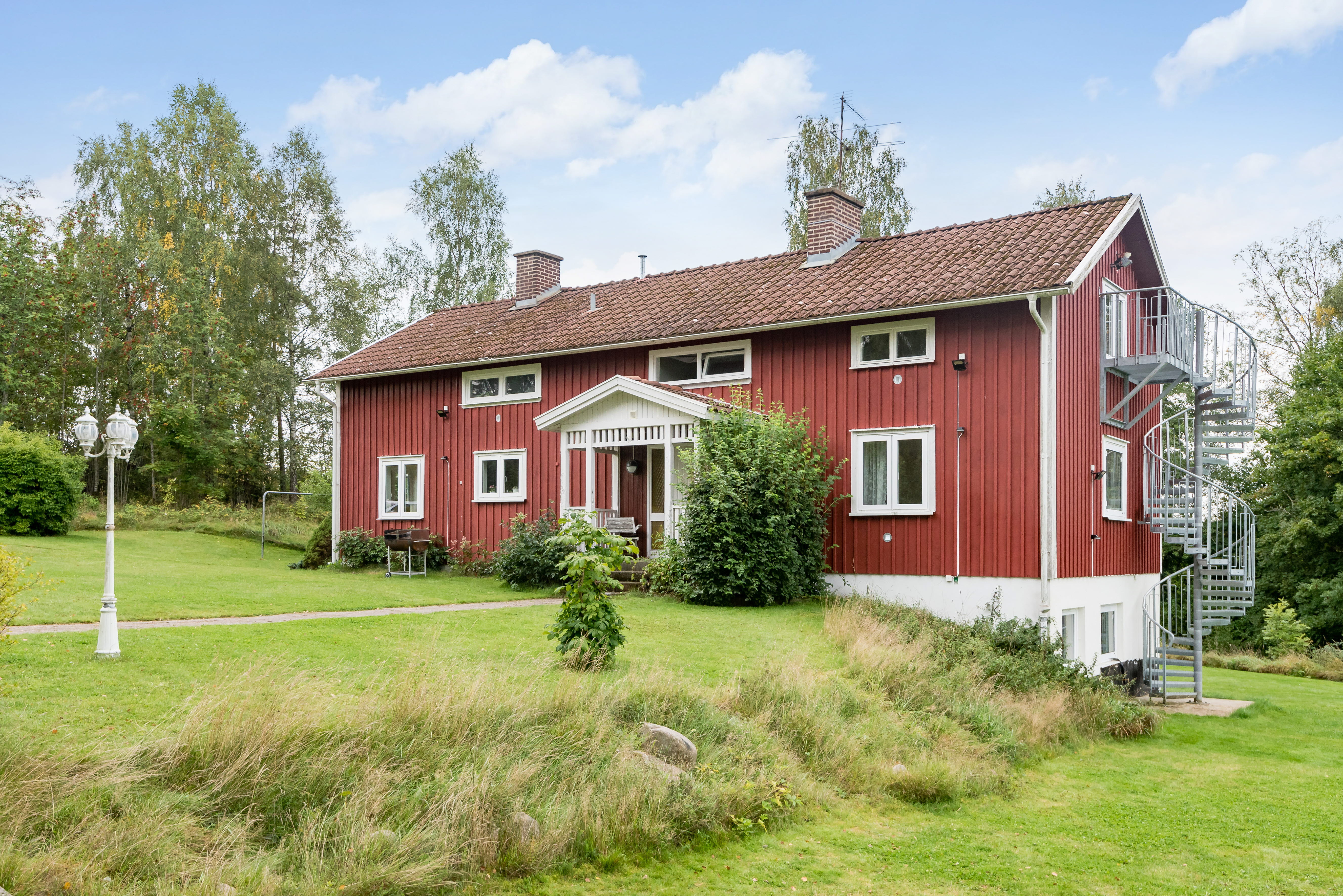 A small house in a grassy yard