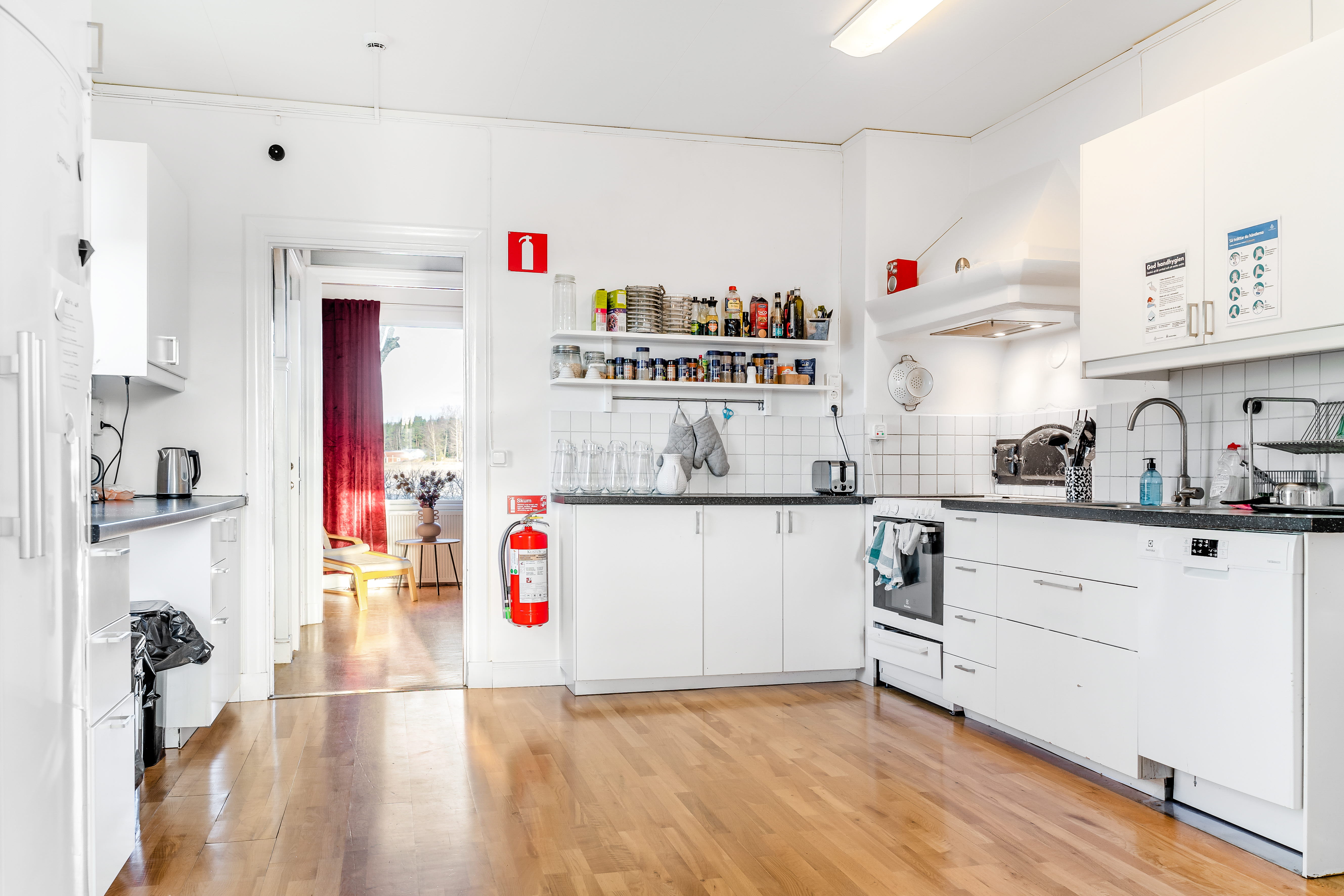 A kitchen with a wood floor