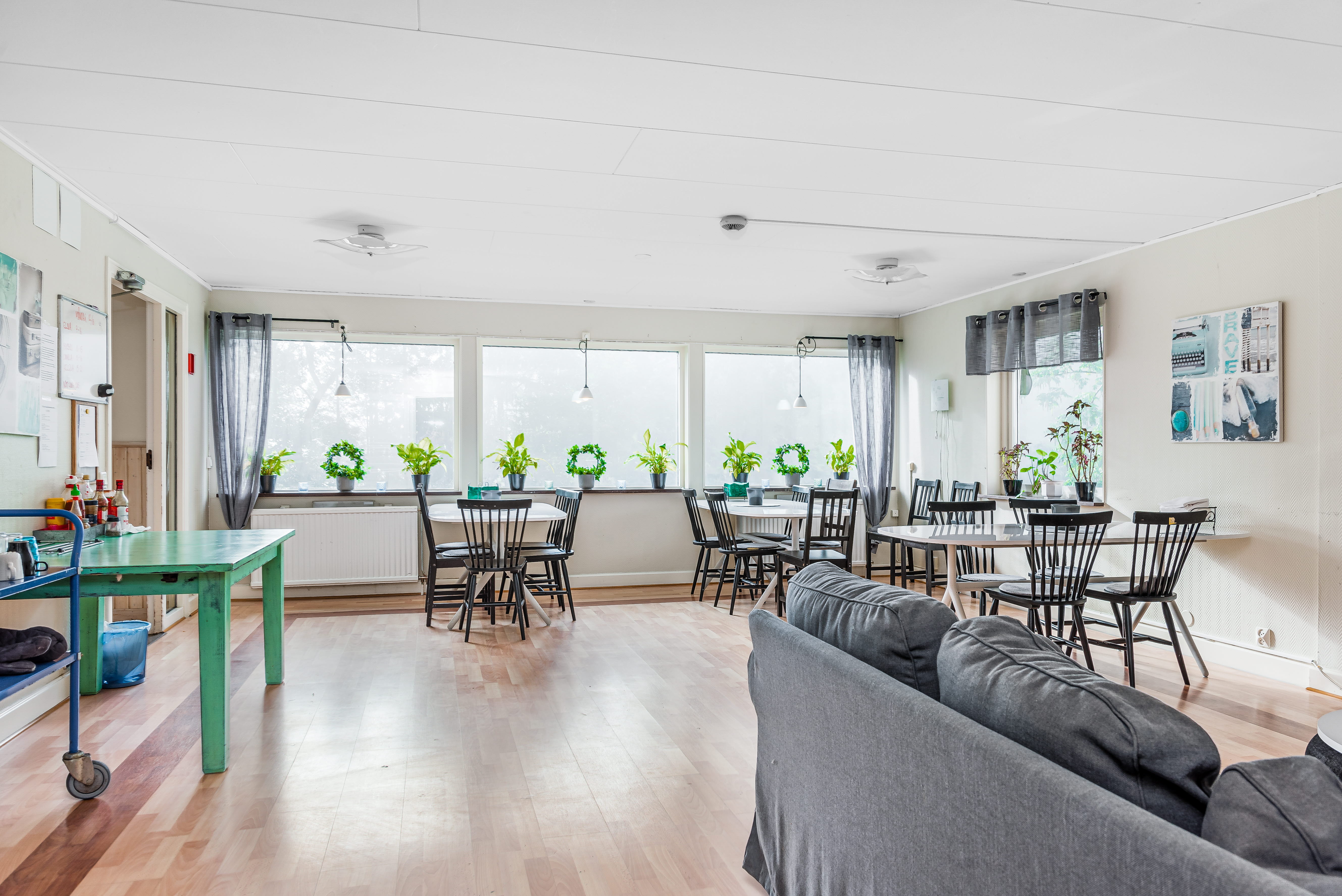 A living room filled with furniture and a large window