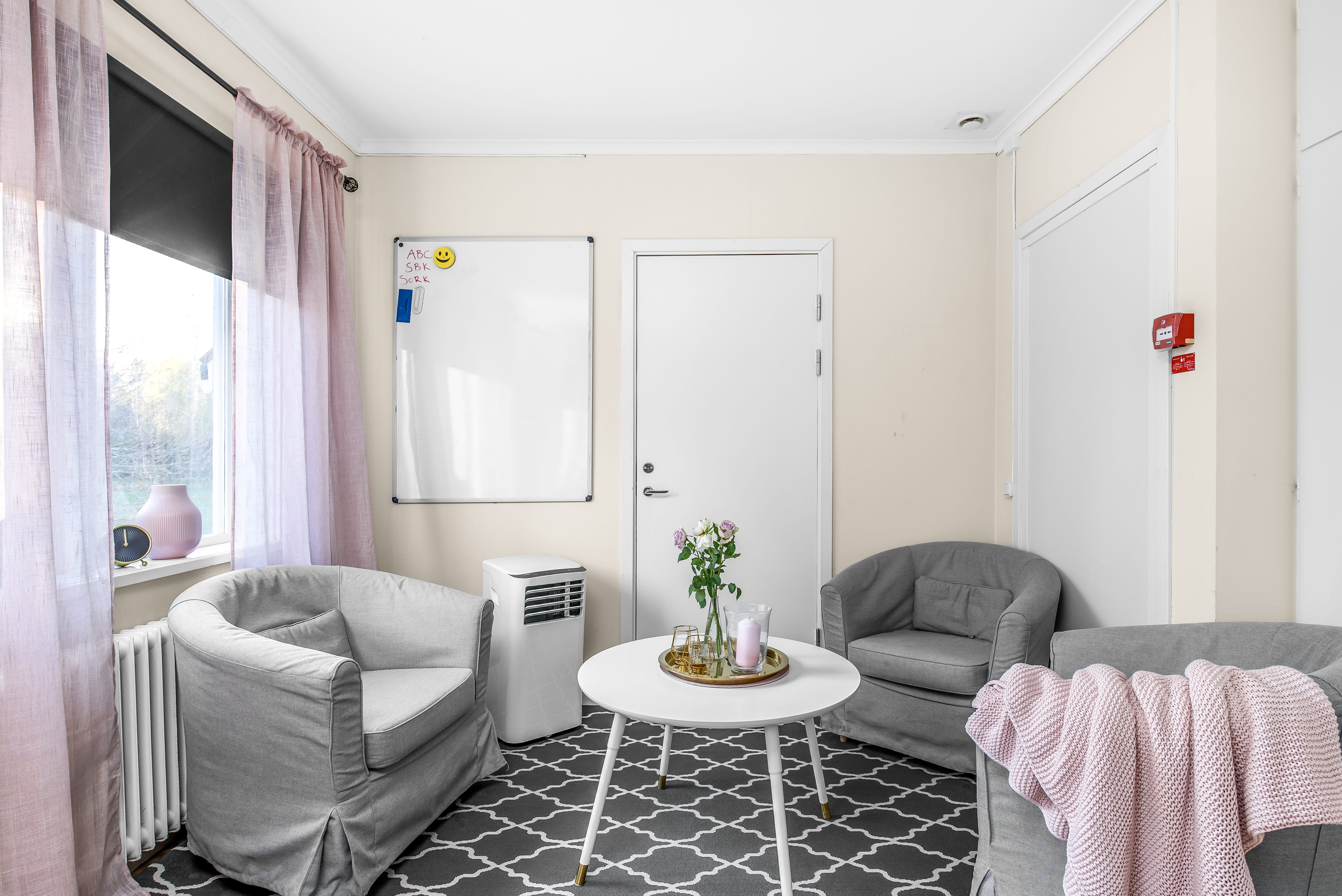 A room filled with furniture and a large window