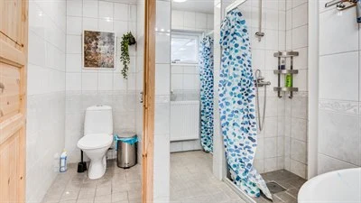 A room with a sink and a shower