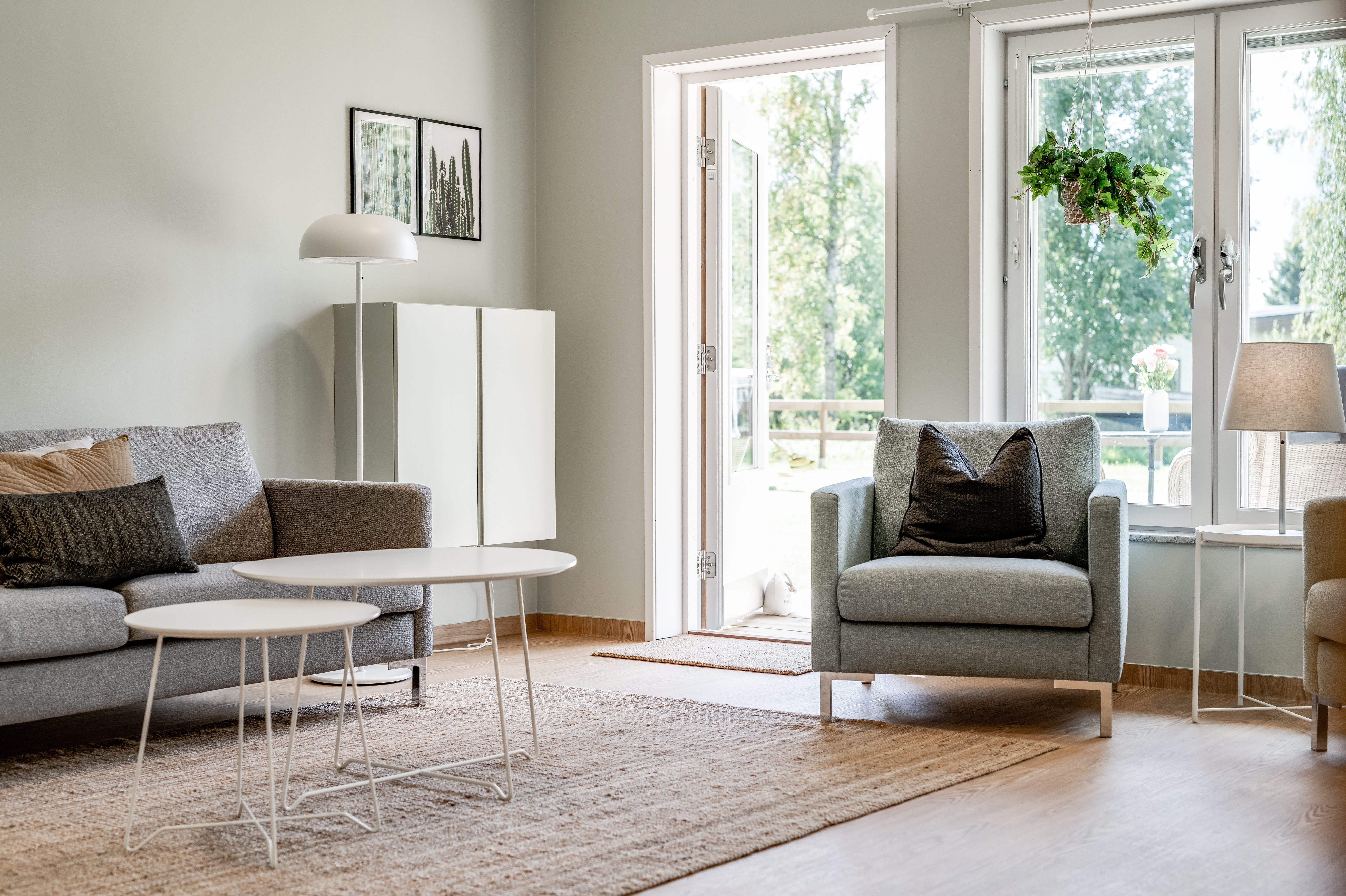 A living room filled with furniture and a large window