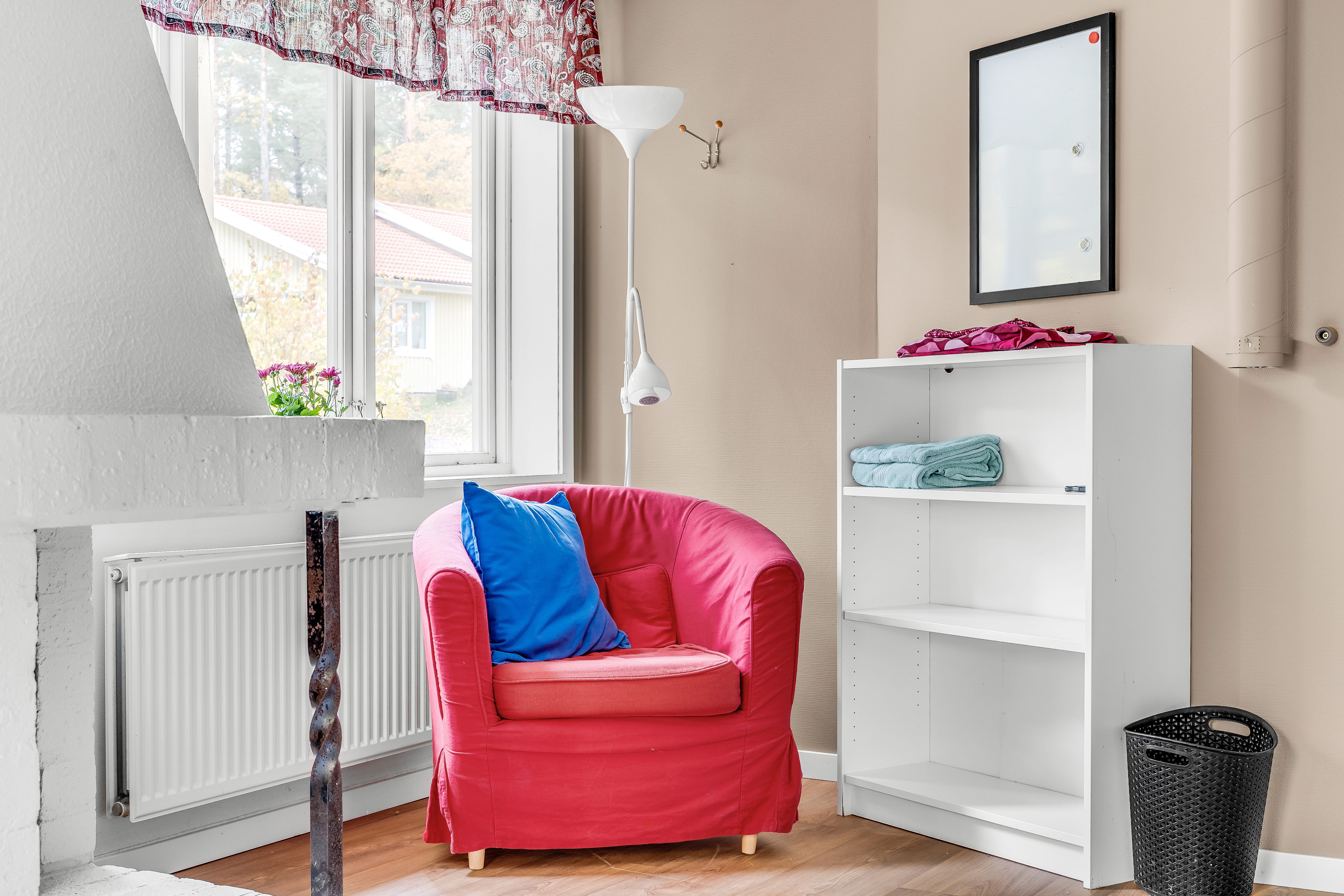 A living room filled with furniture and a window