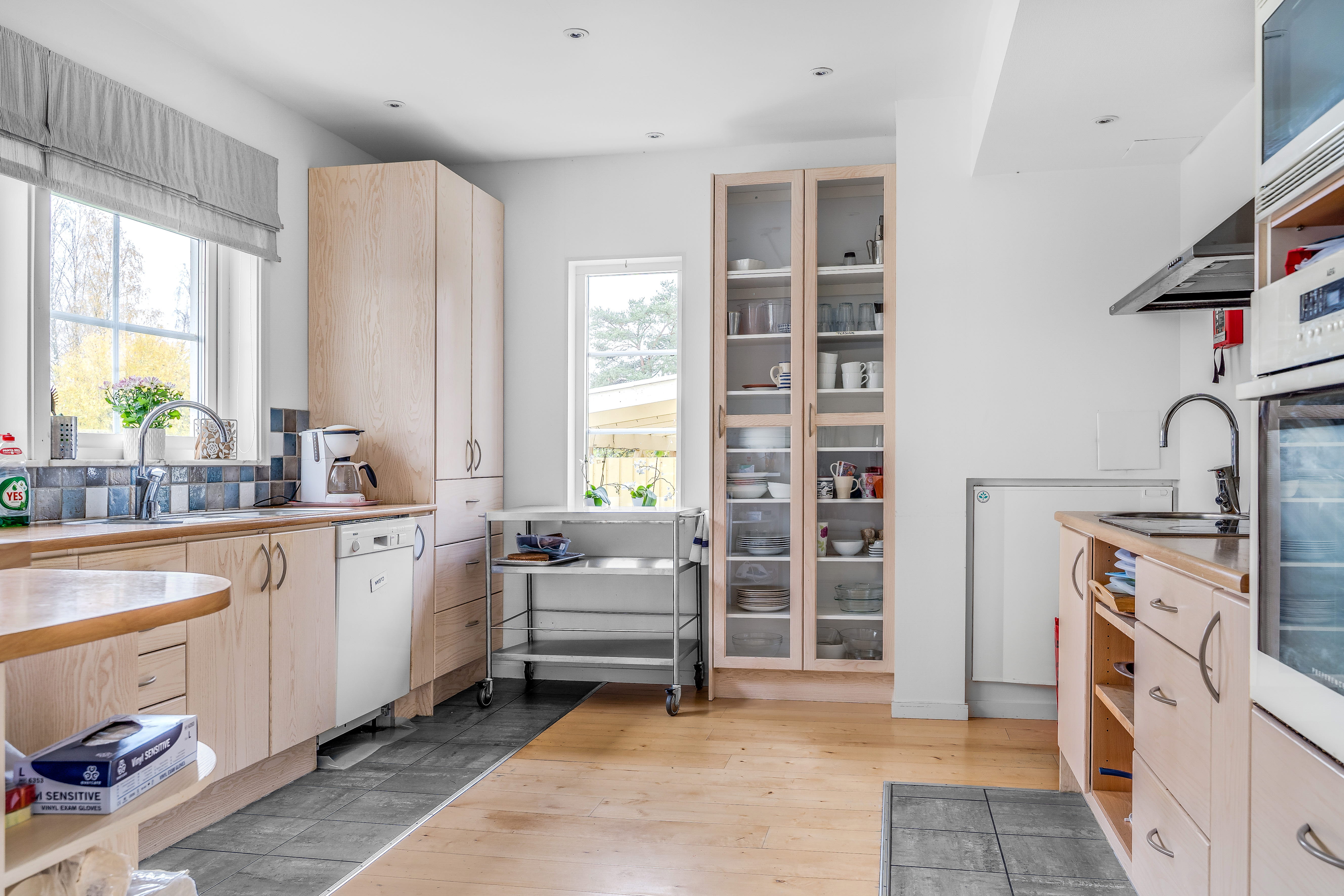 A kitchen with a large window
