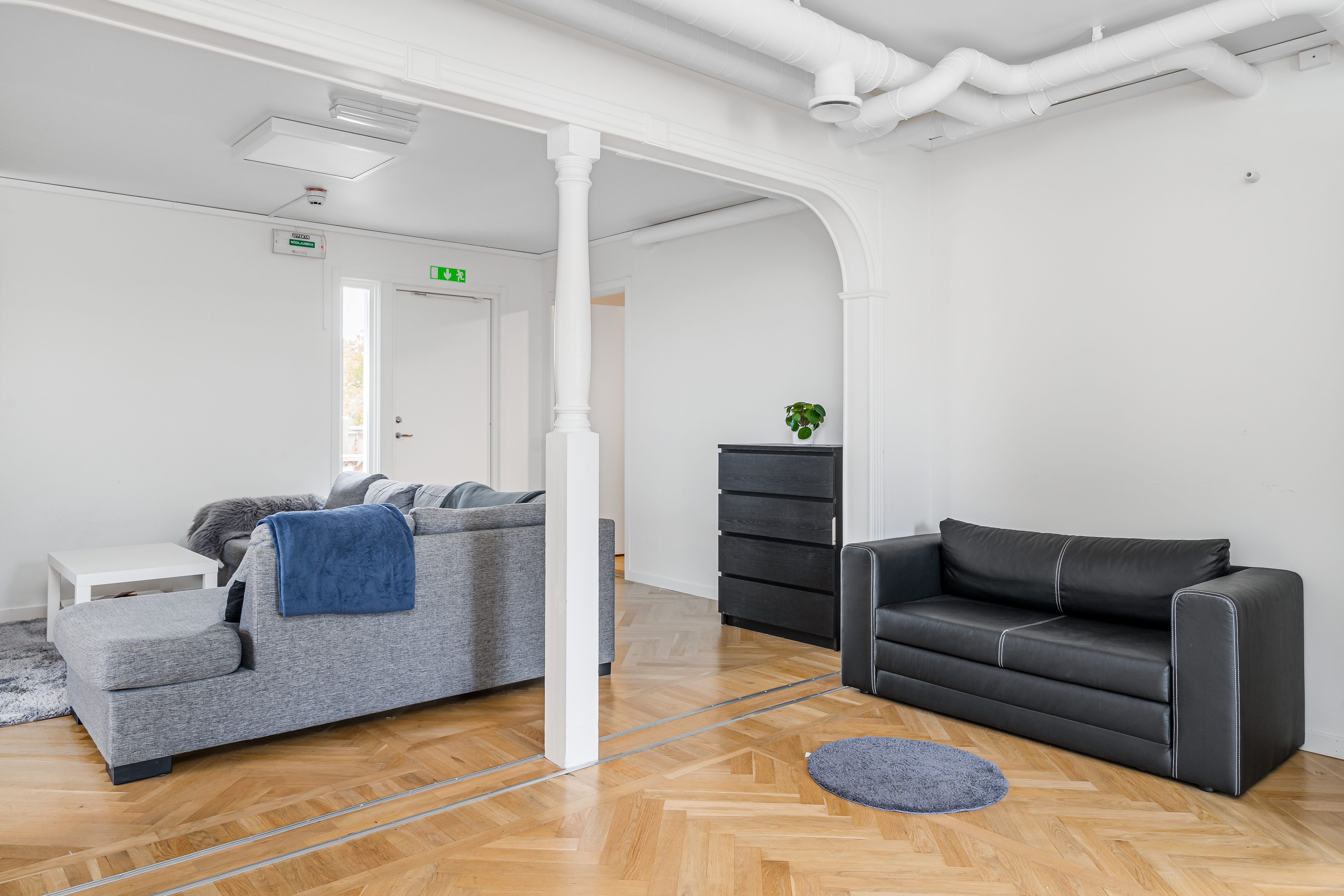 A living room with a wood floor