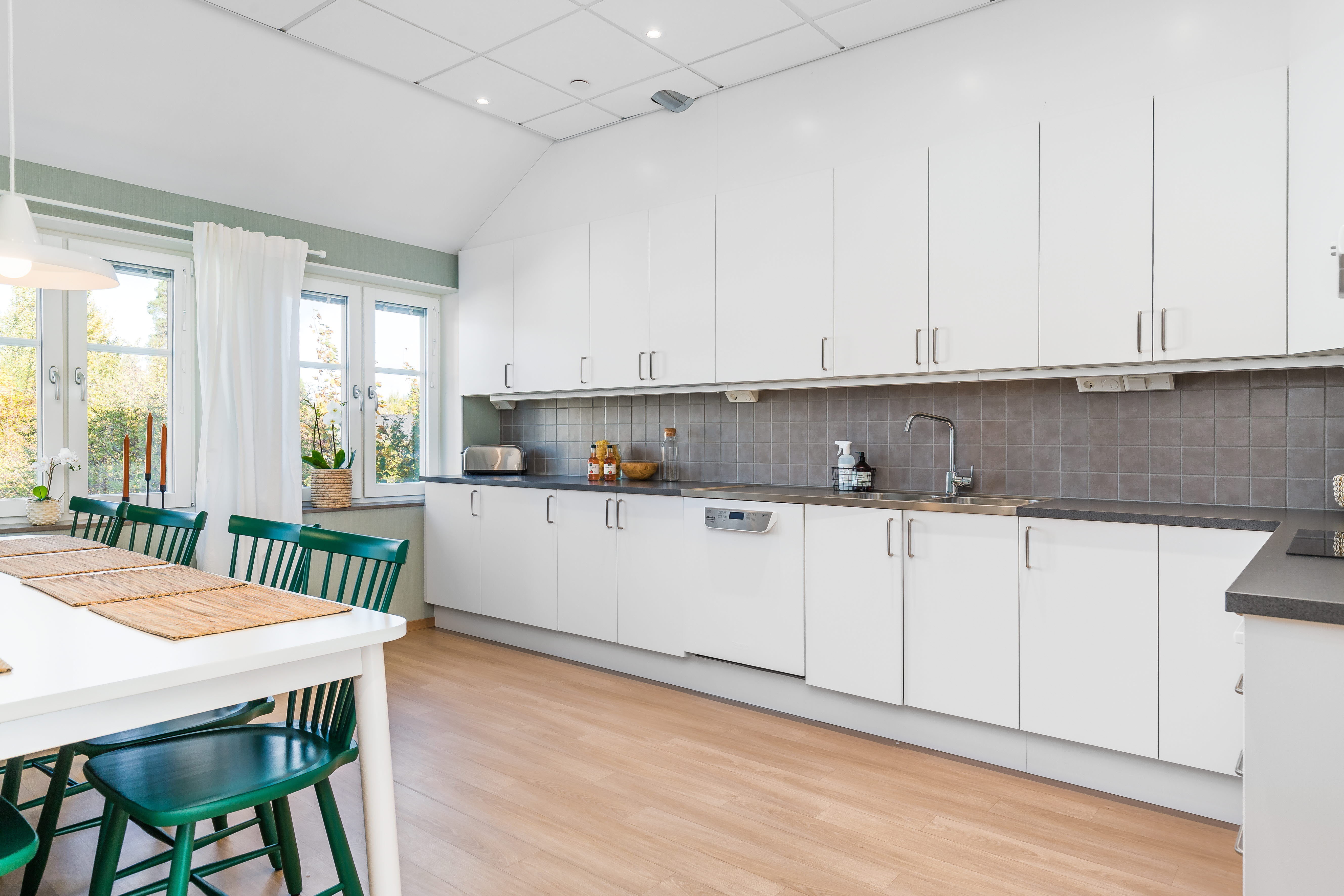 A kitchen with a wood floor