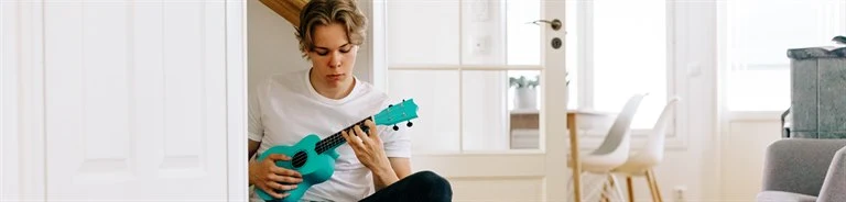 A boy playing a guitar