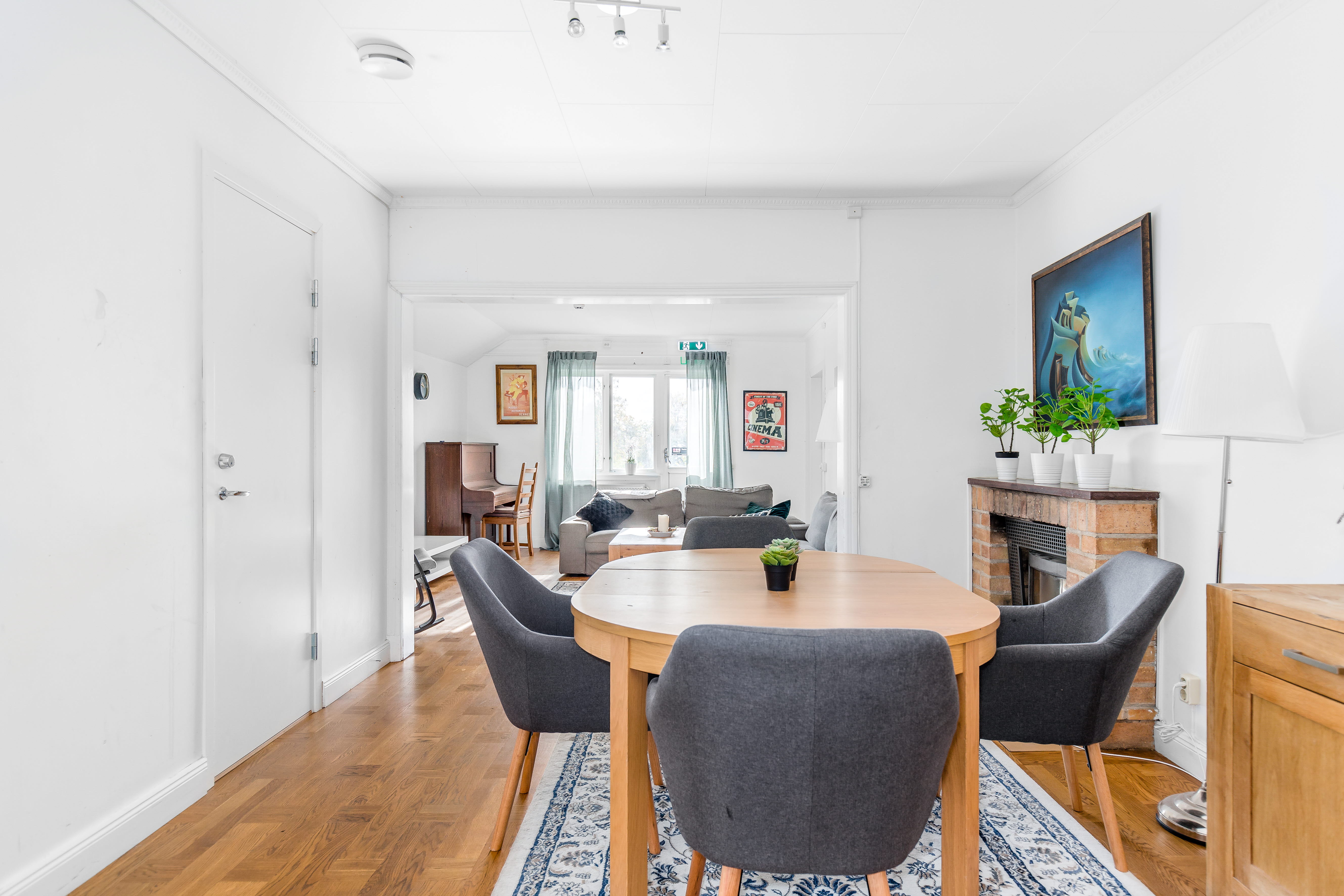 A living room filled with furniture and a large window