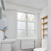 A room with a sink and a window