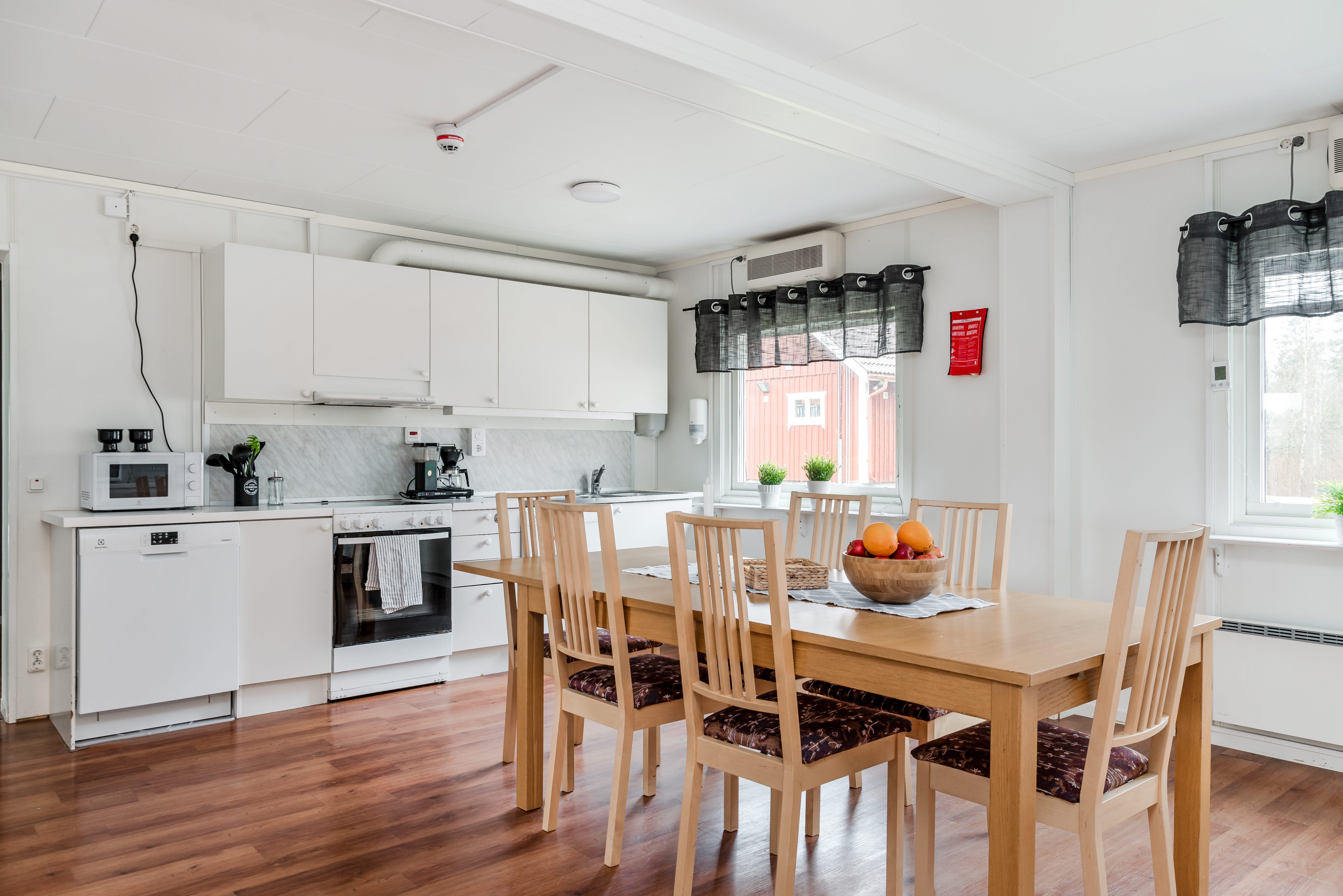 A kitchen with a dining room table