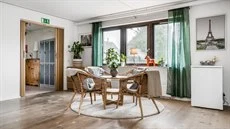 A living room filled with furniture and a large window