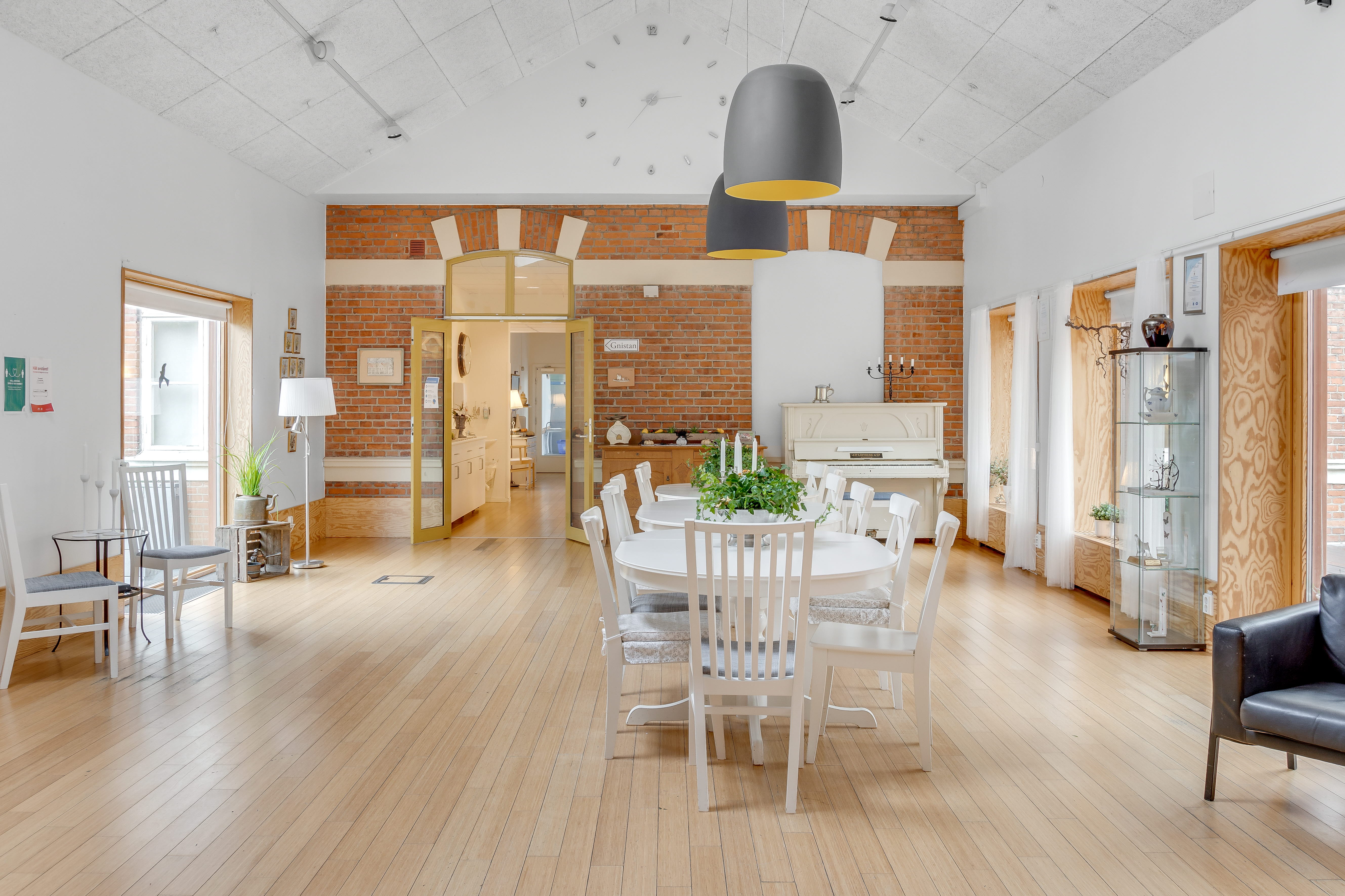 A living room filled with furniture on top of a hard wood floor
