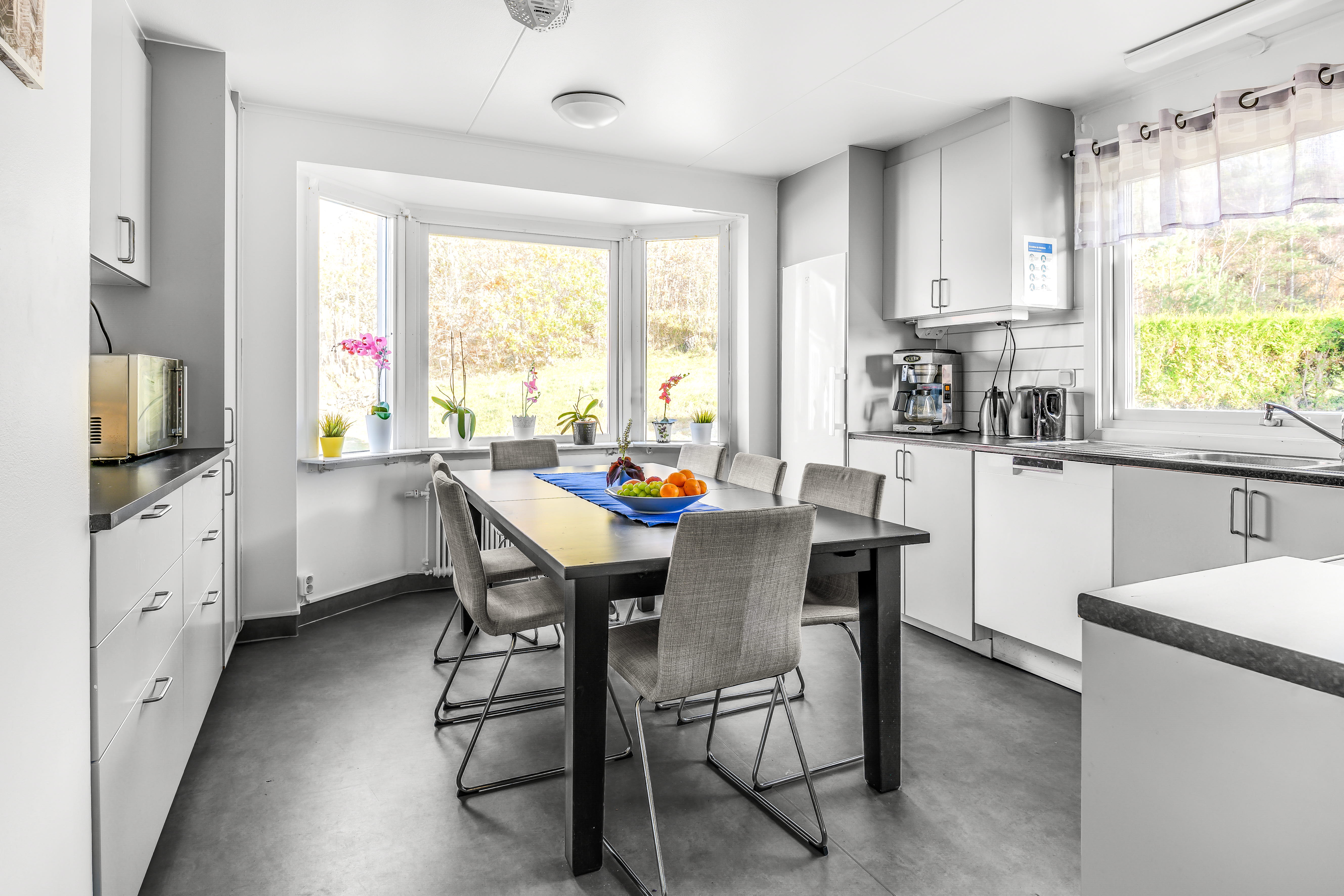 A kitchen with a window in a room