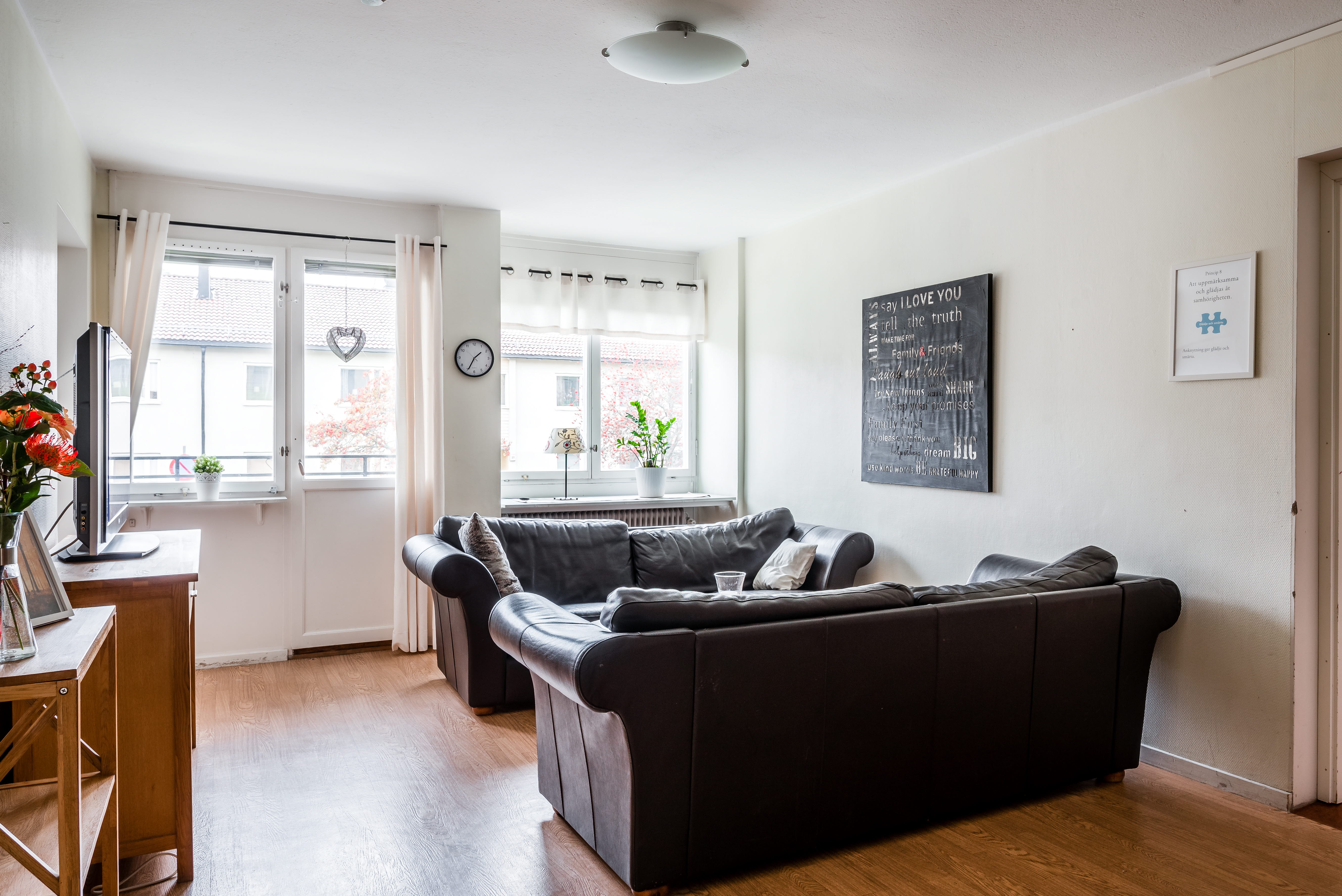 A living room filled with furniture and a large window