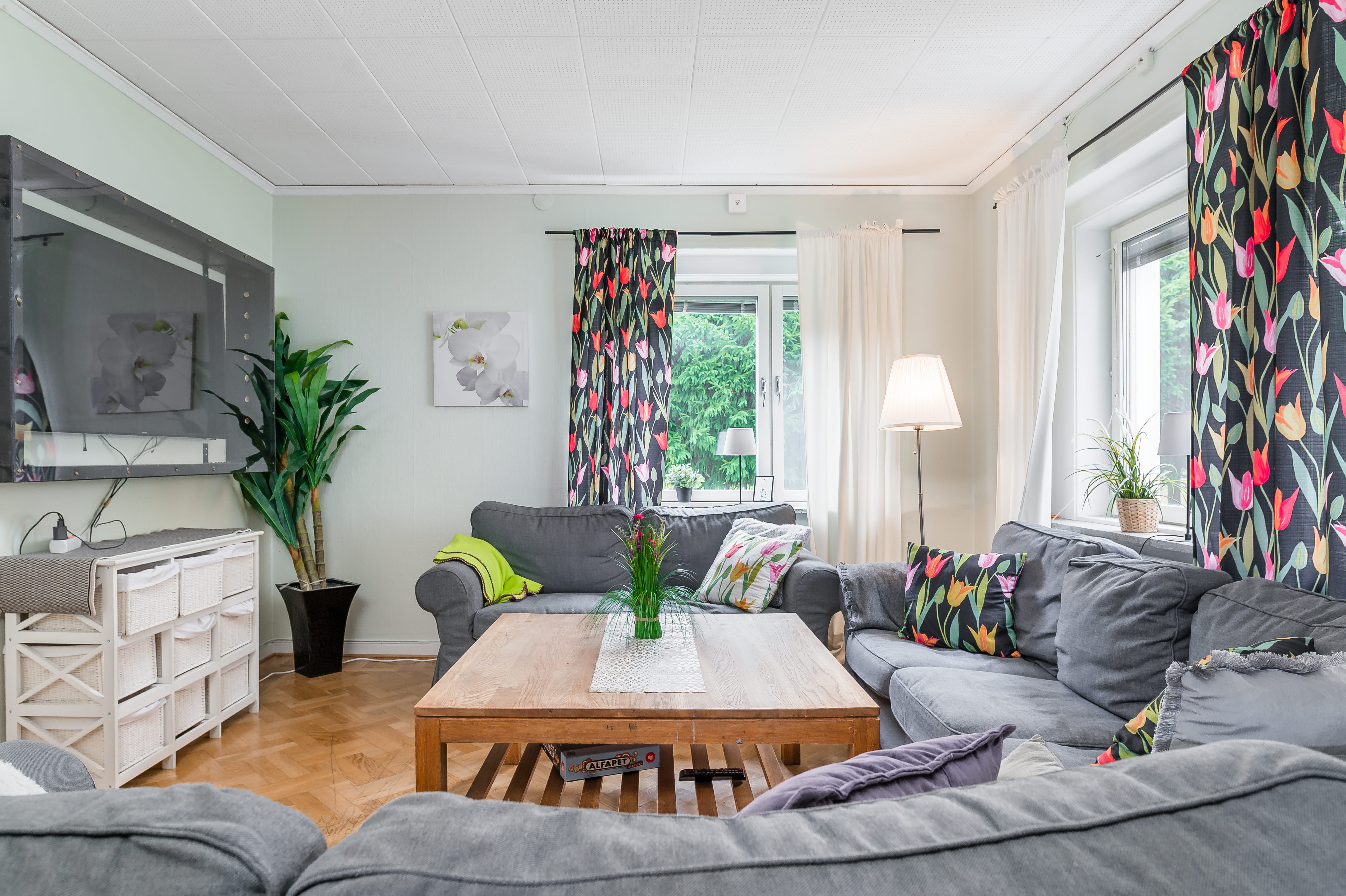 A living room filled with furniture and a large window