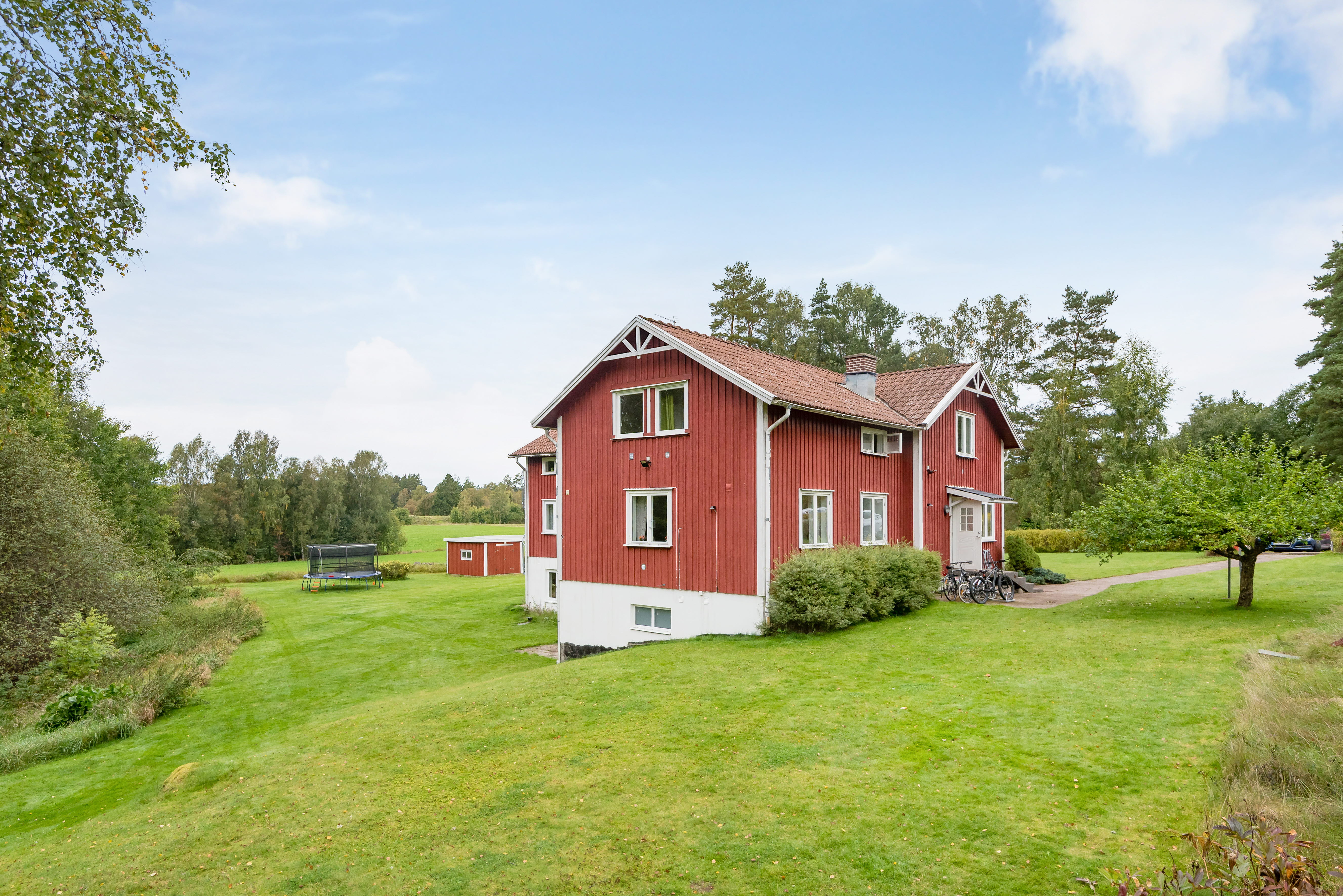 A house on top of a lush green field