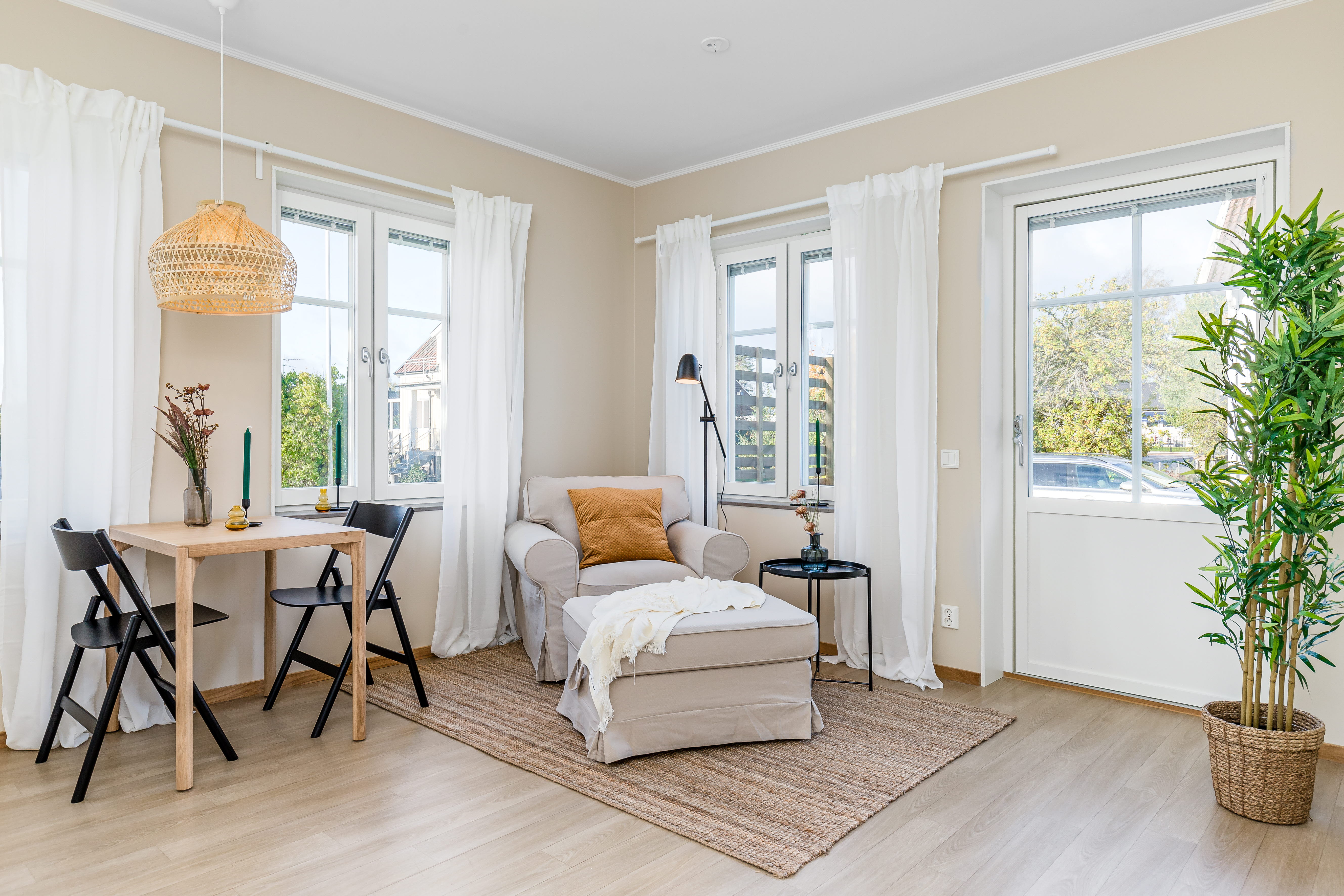A living room filled with furniture and a large window