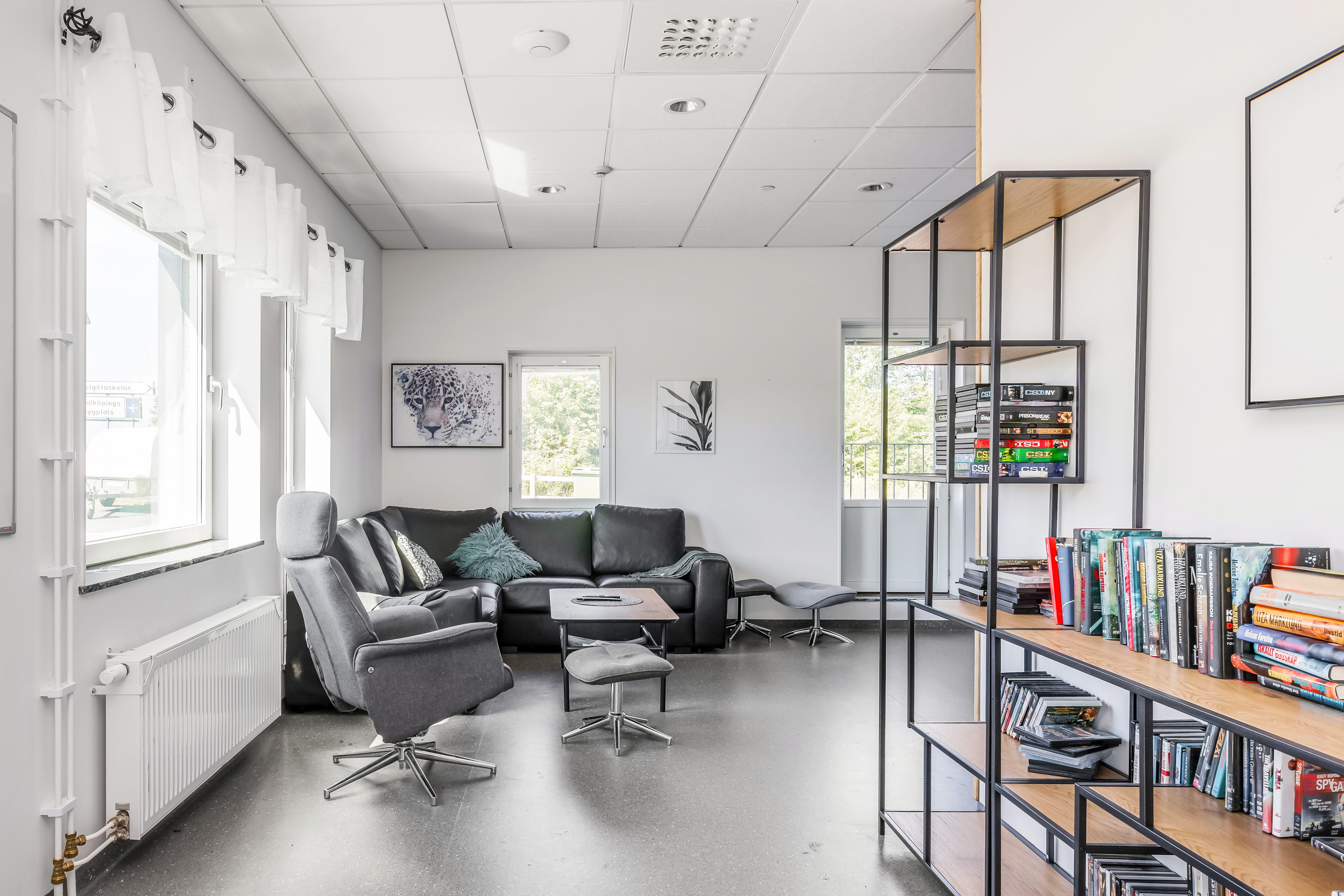 A living room filled with furniture and a large window