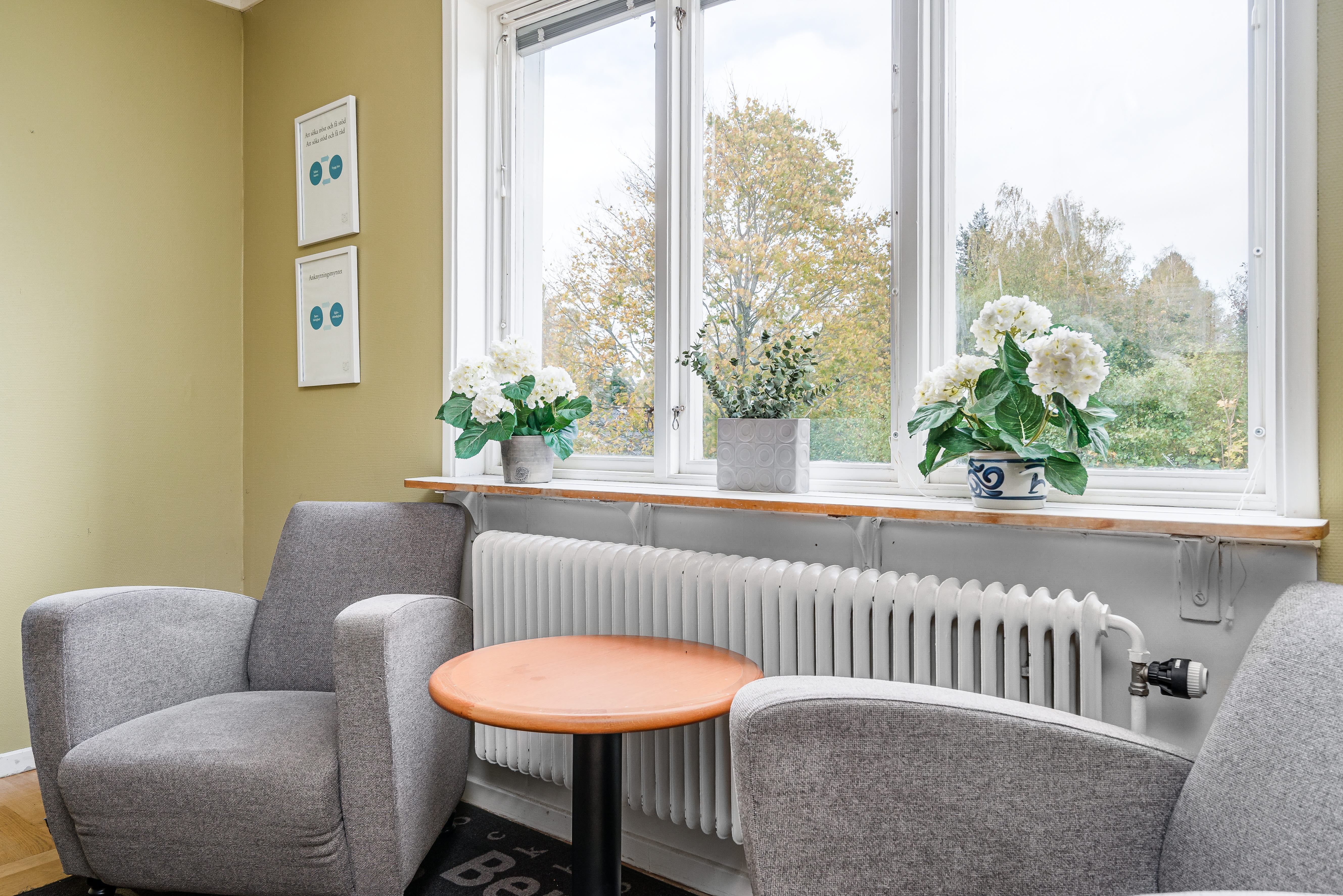 A living room filled with furniture and a large window