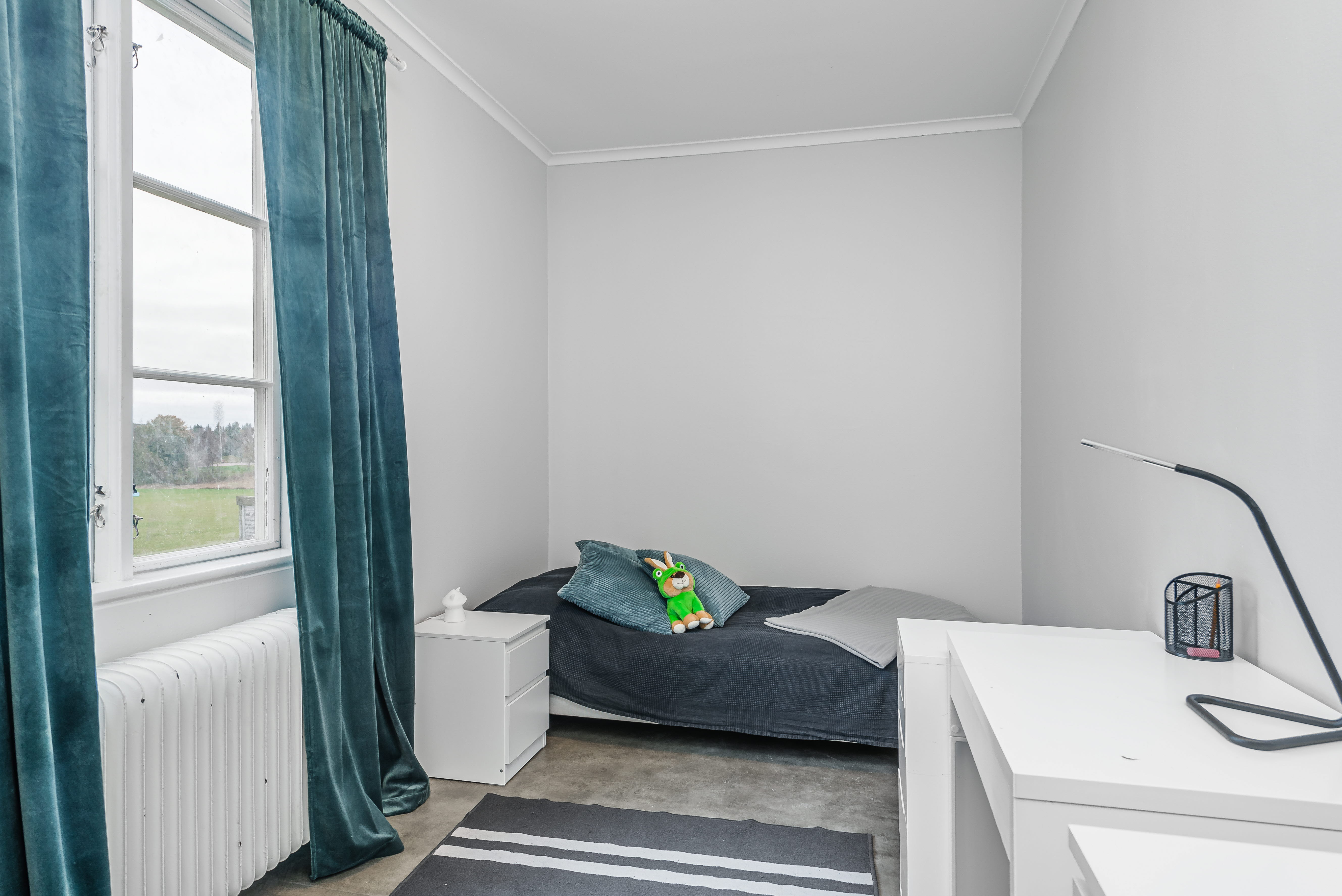 A bedroom with a large window