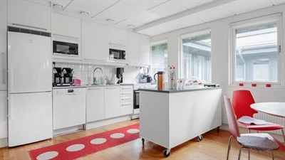 A kitchen with a wood floor