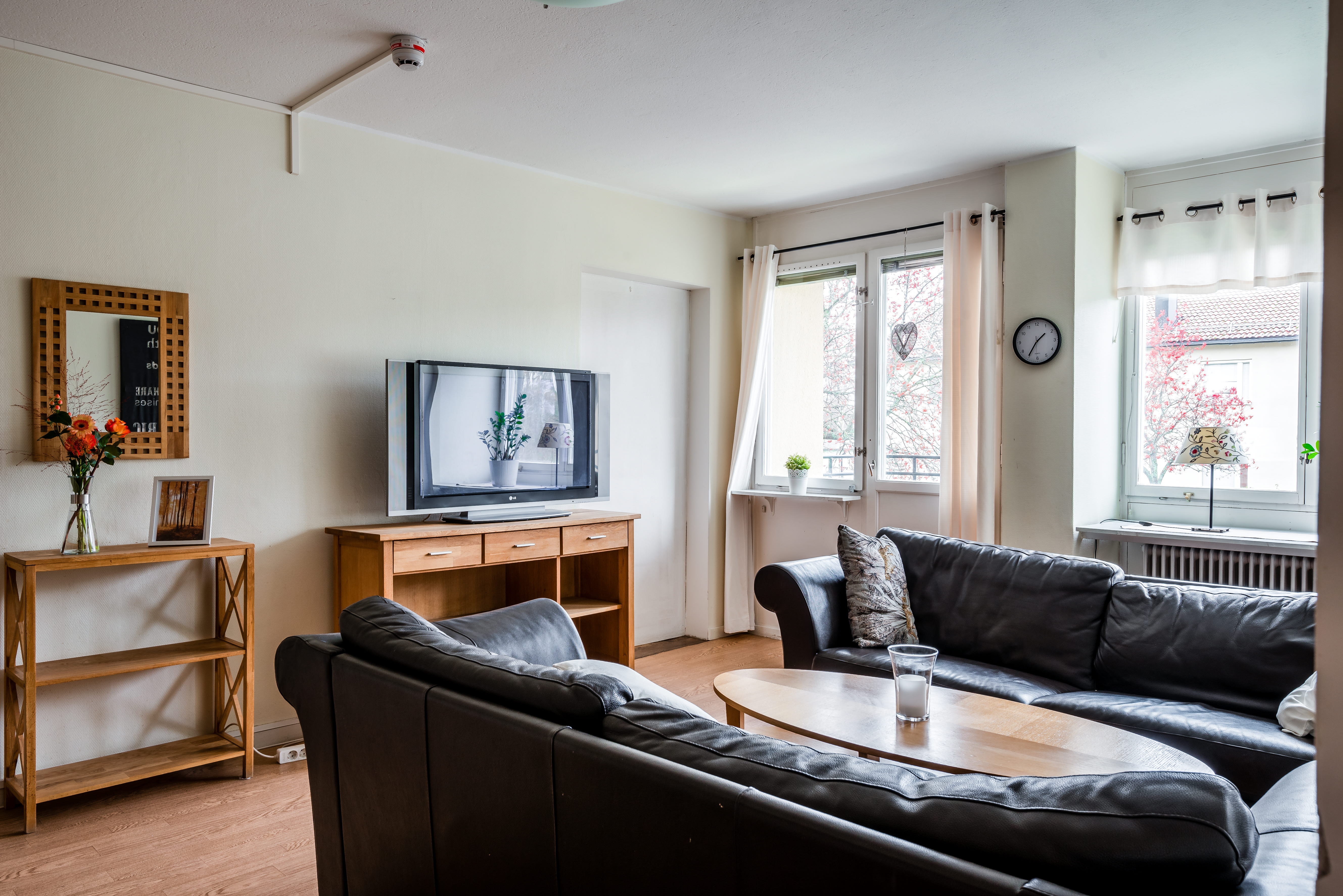 A living room filled with furniture and a large window