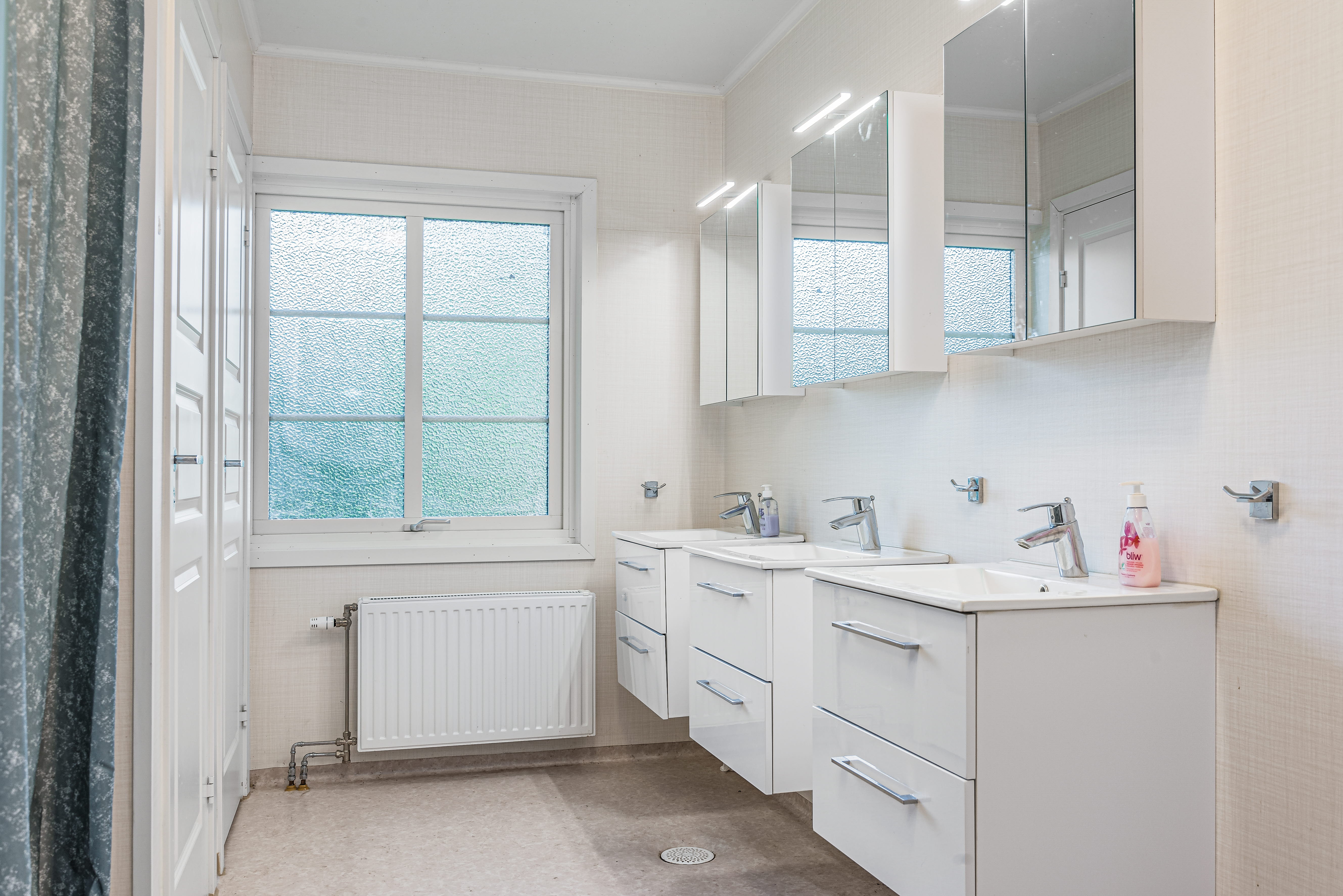 A room with a sink and a window