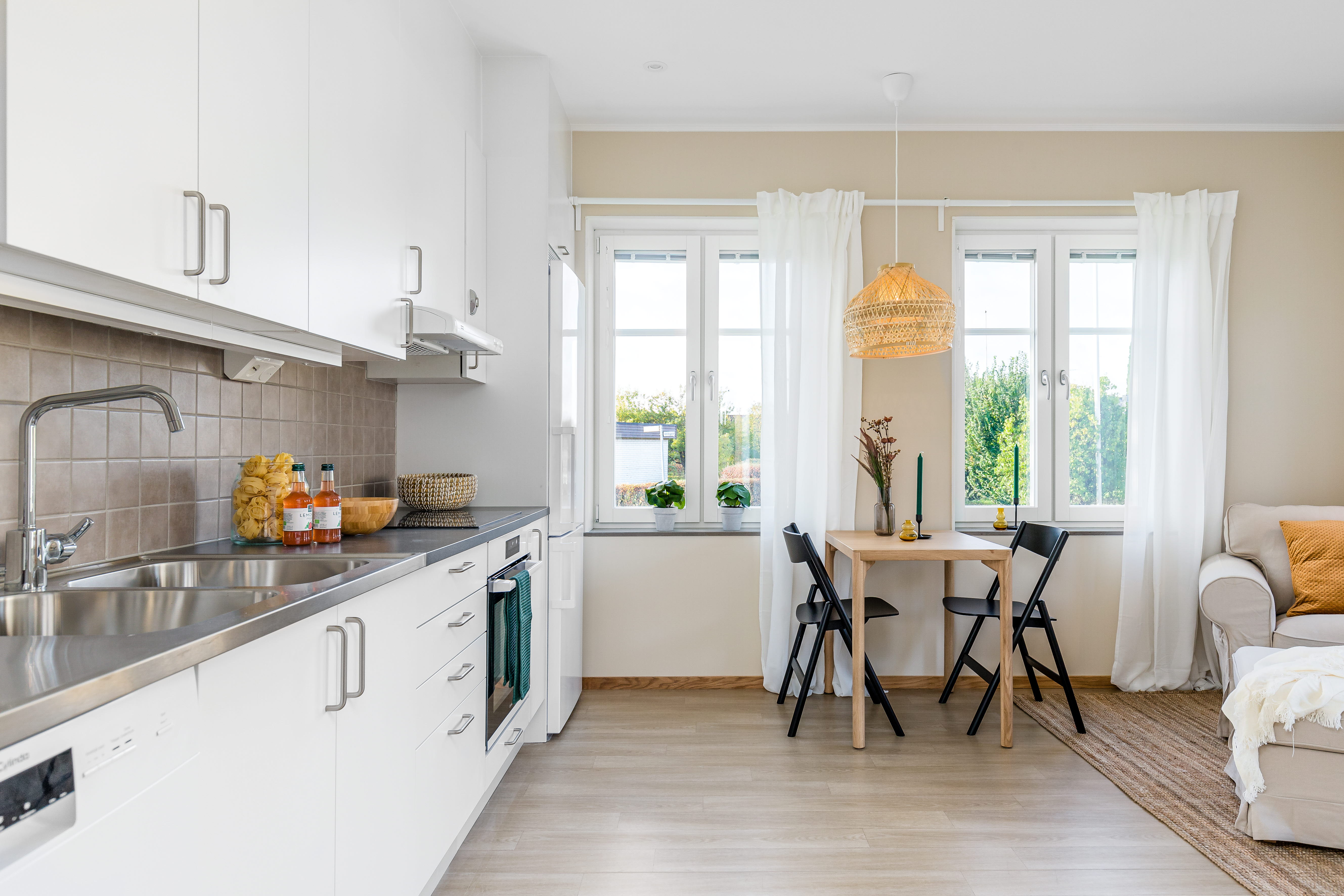 A kitchen with a wood floor