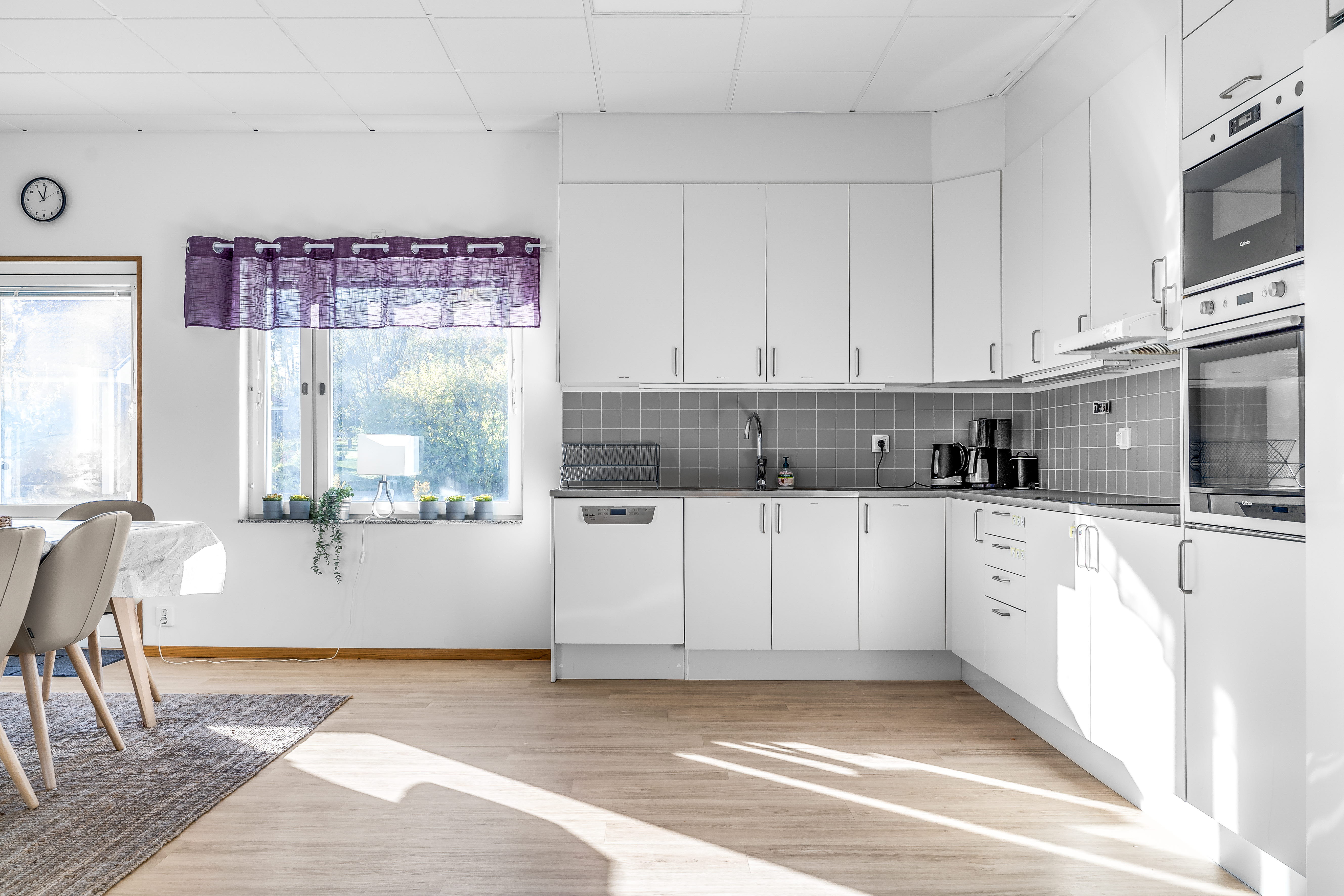 A room filled with furniture and a large window