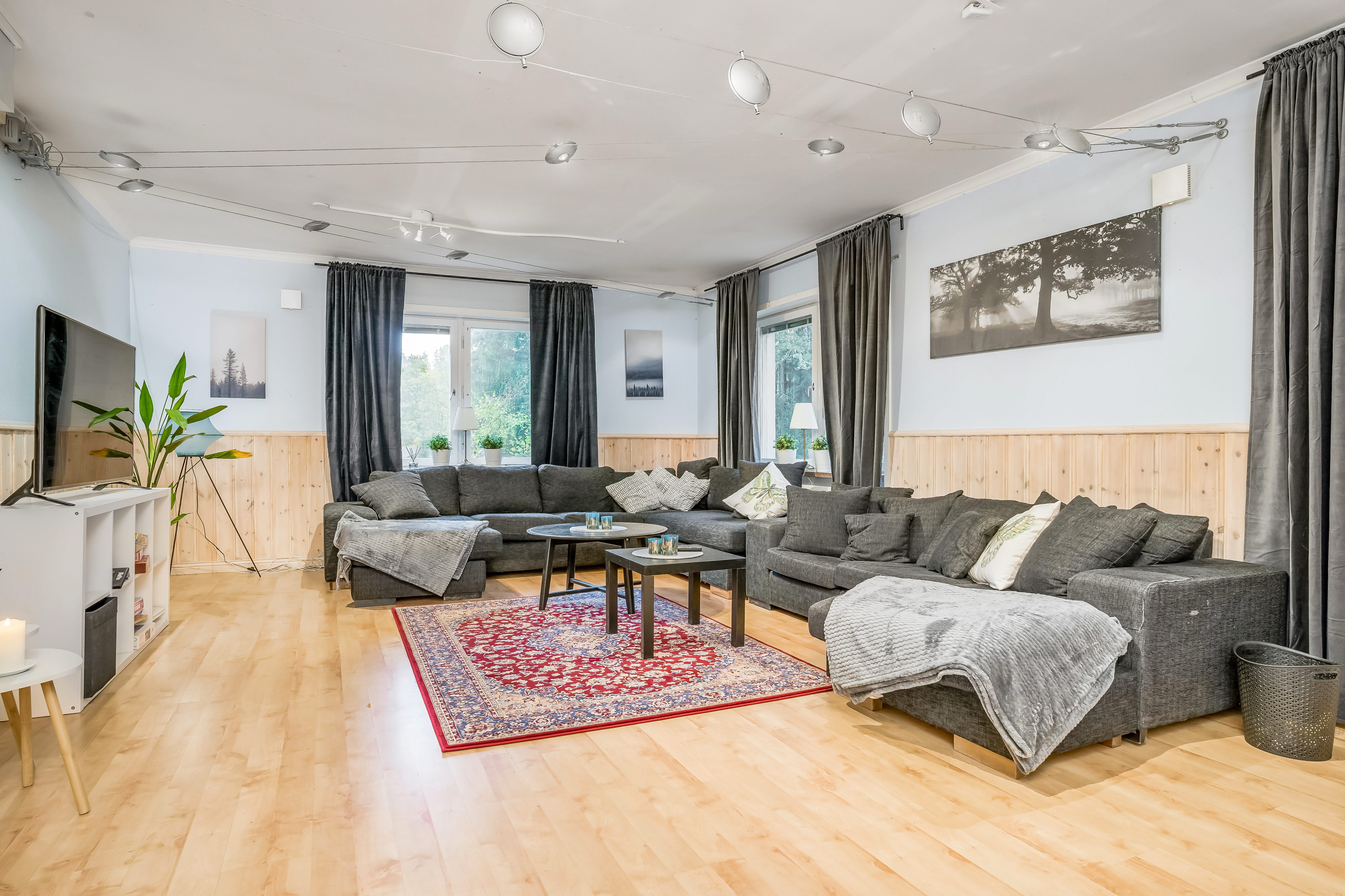 A living room filled with furniture and a large window