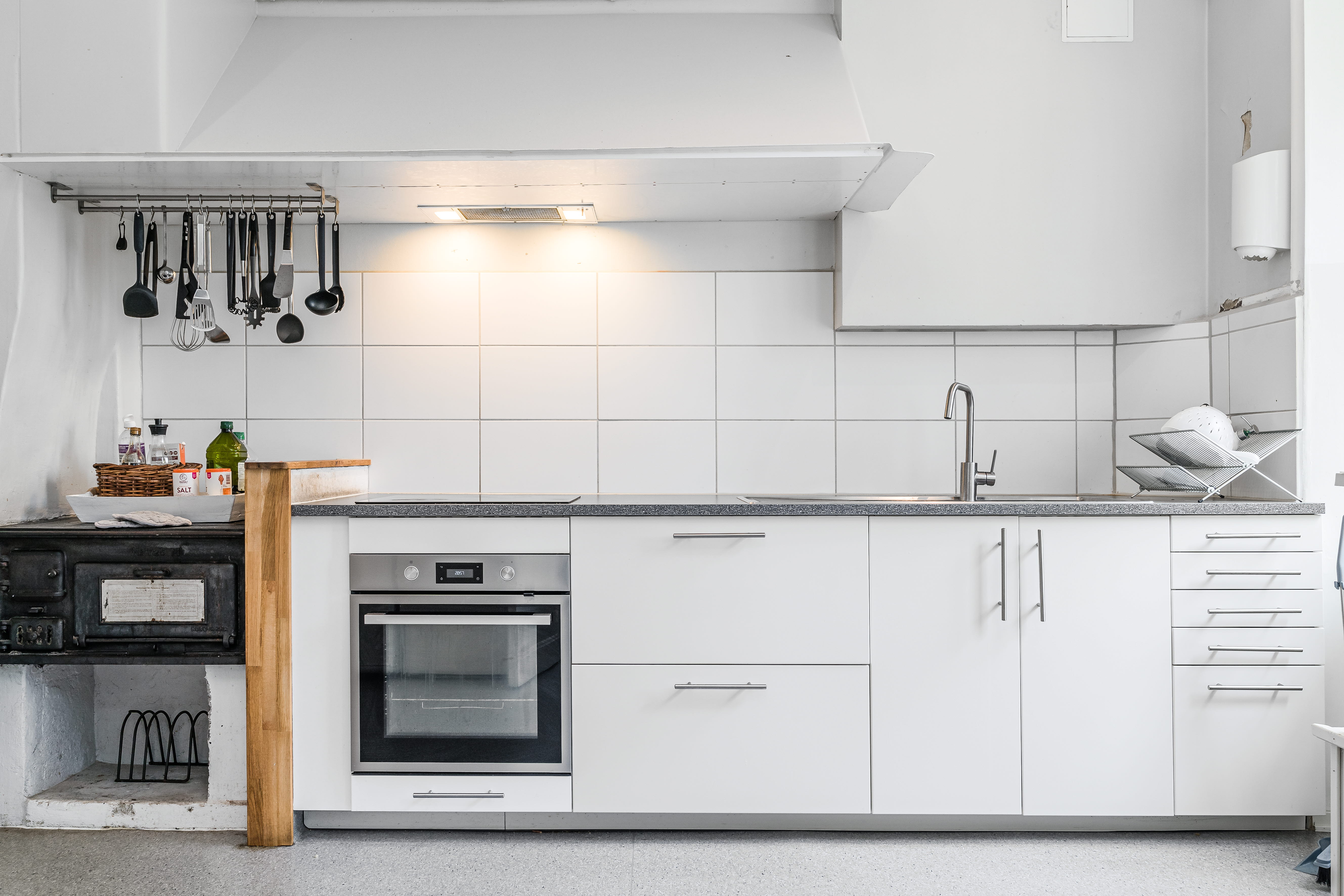 A stove top oven sitting inside of a kitchen