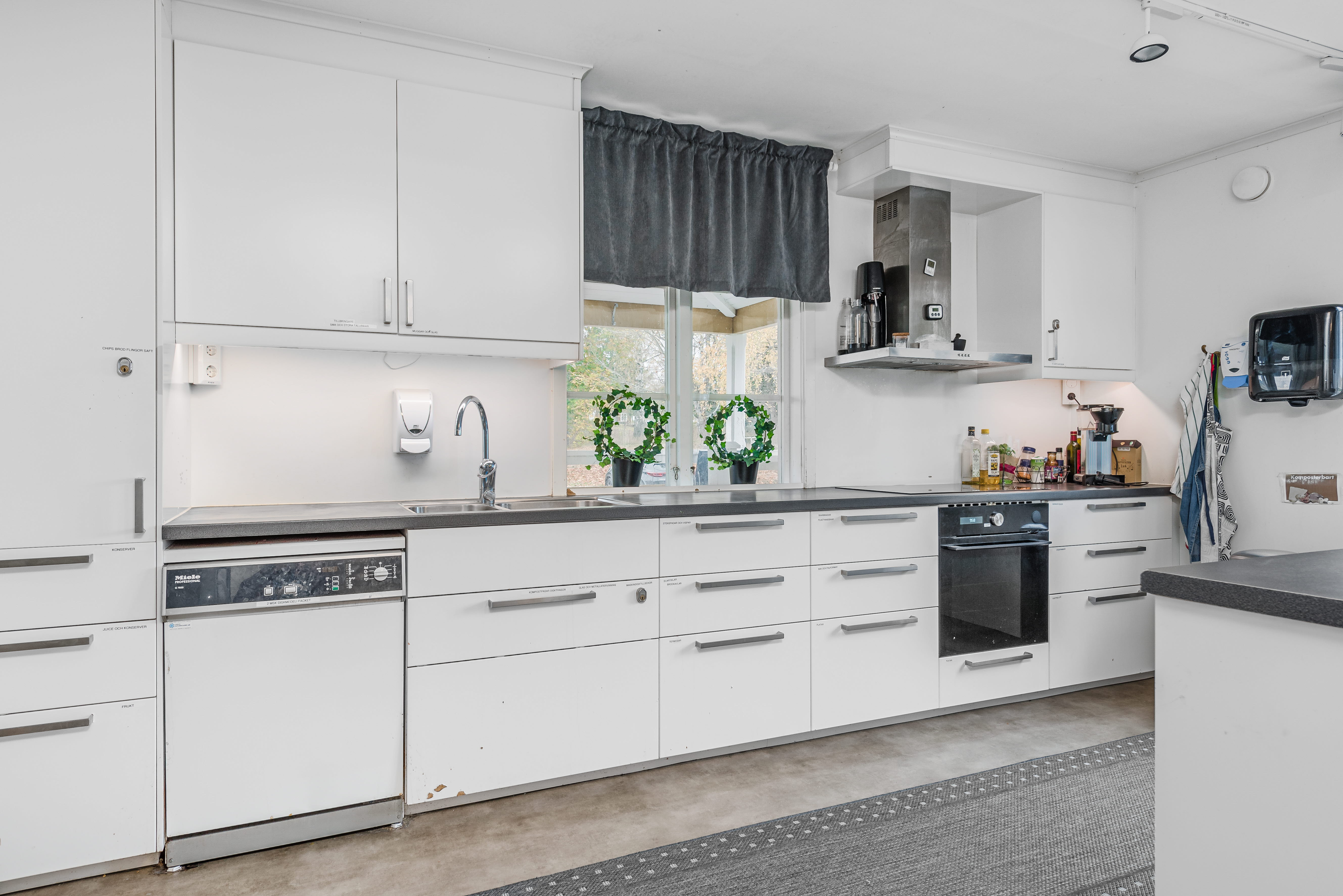 A large kitchen with stainless steel appliances
