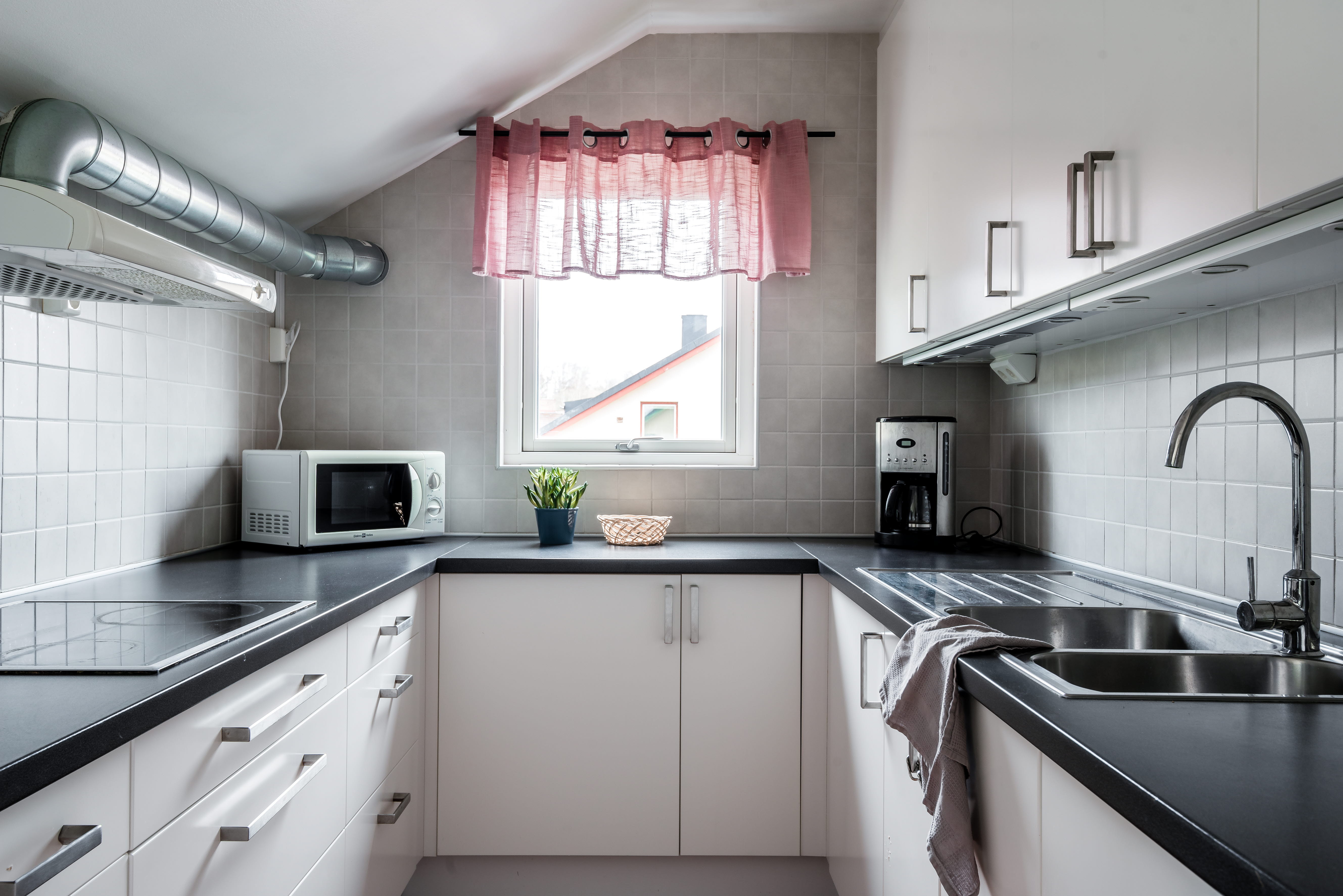 A kitchen with a stove and a sink