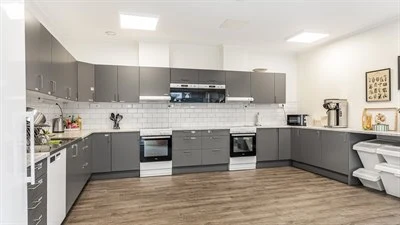 A large kitchen with stainless steel appliances